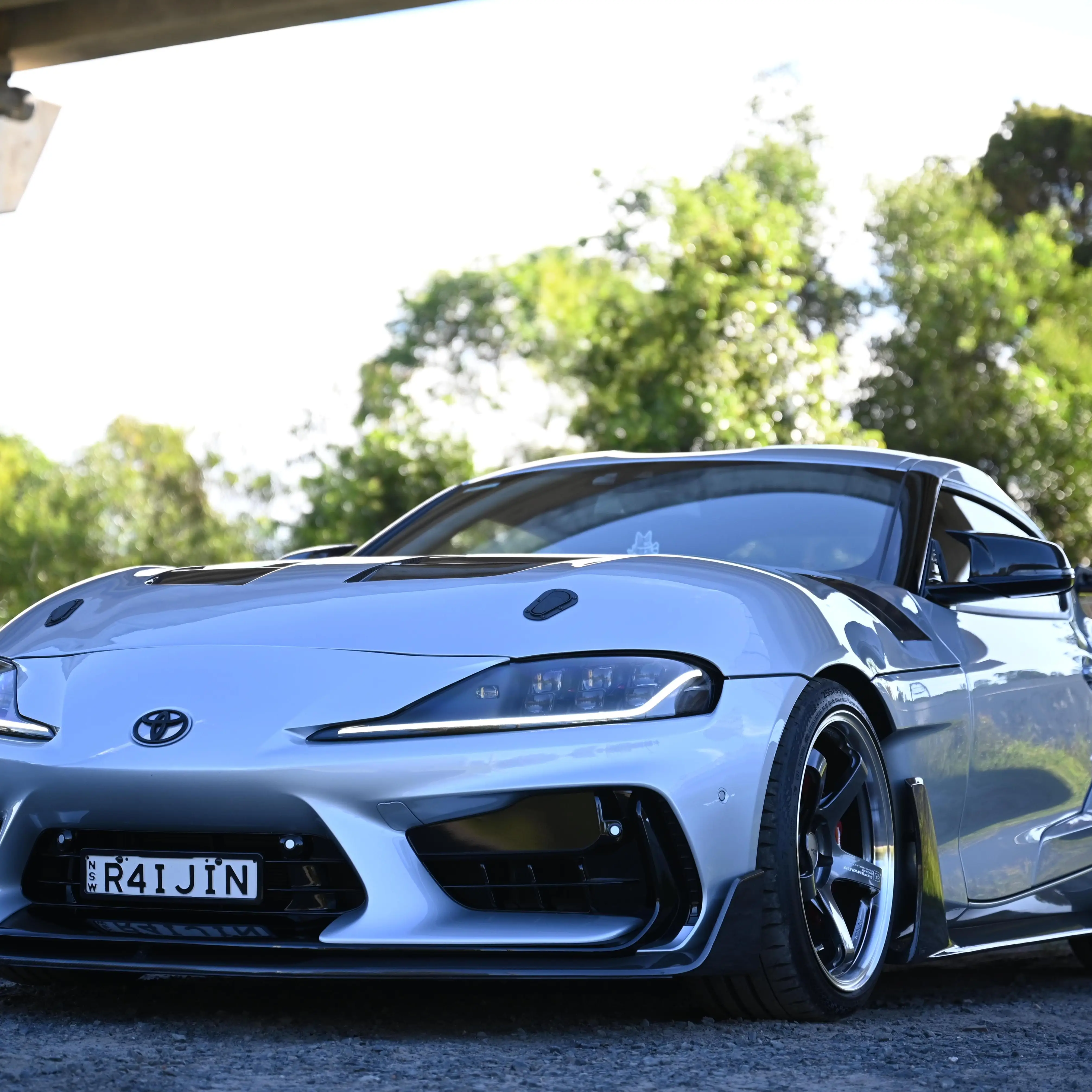 Flush wheel fitment on Toyota GR Supra featuring 19-inch Advan GT Beyond wheels in Hyper Platinum Black