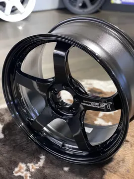 Close up detailing the authentic 3D machined Advan Racing GT Beyond logo lettering on a titanium black spoke