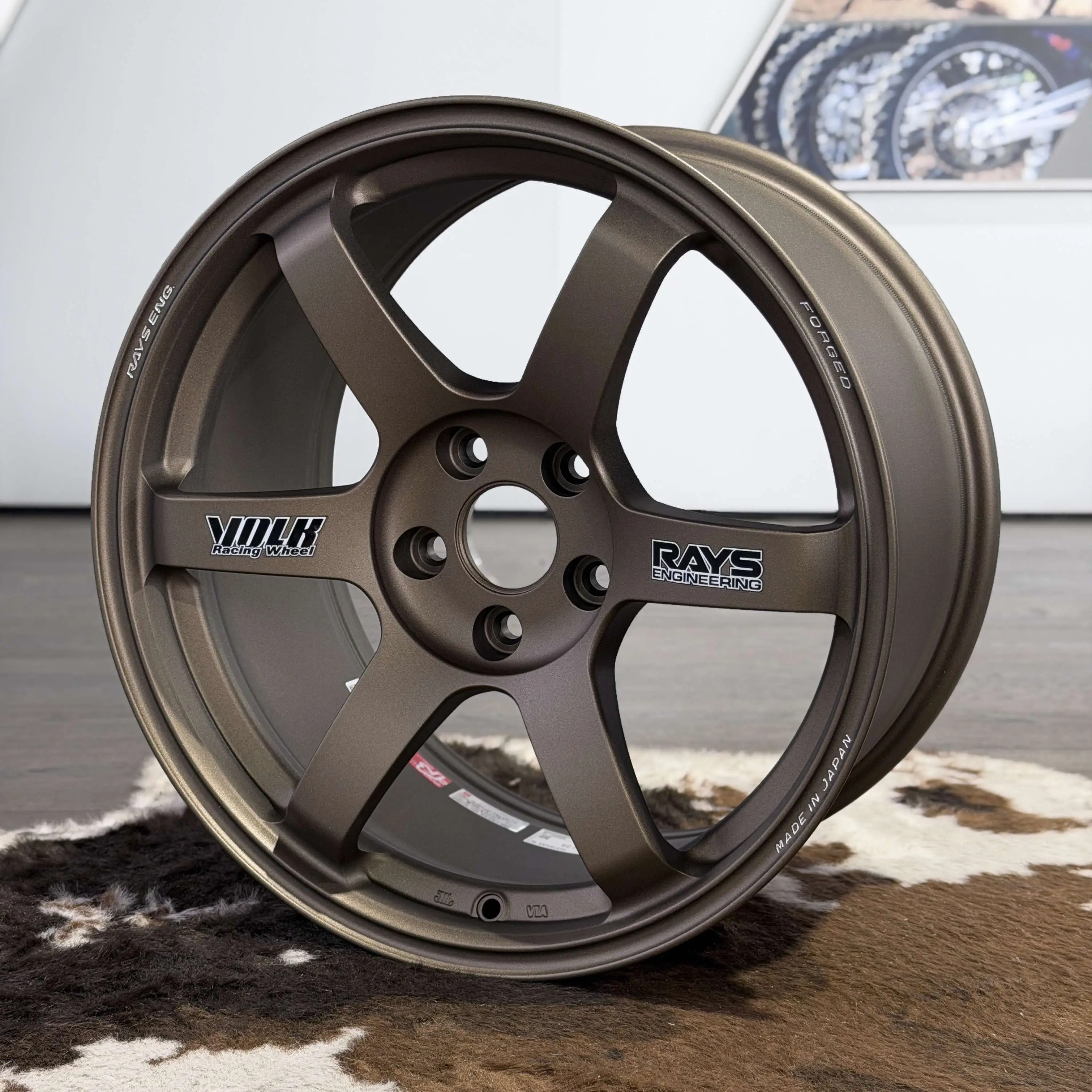 close up highlighting the rigid spoke design and deep drop center of a Matte Gun Bronze TE37 Saga SL