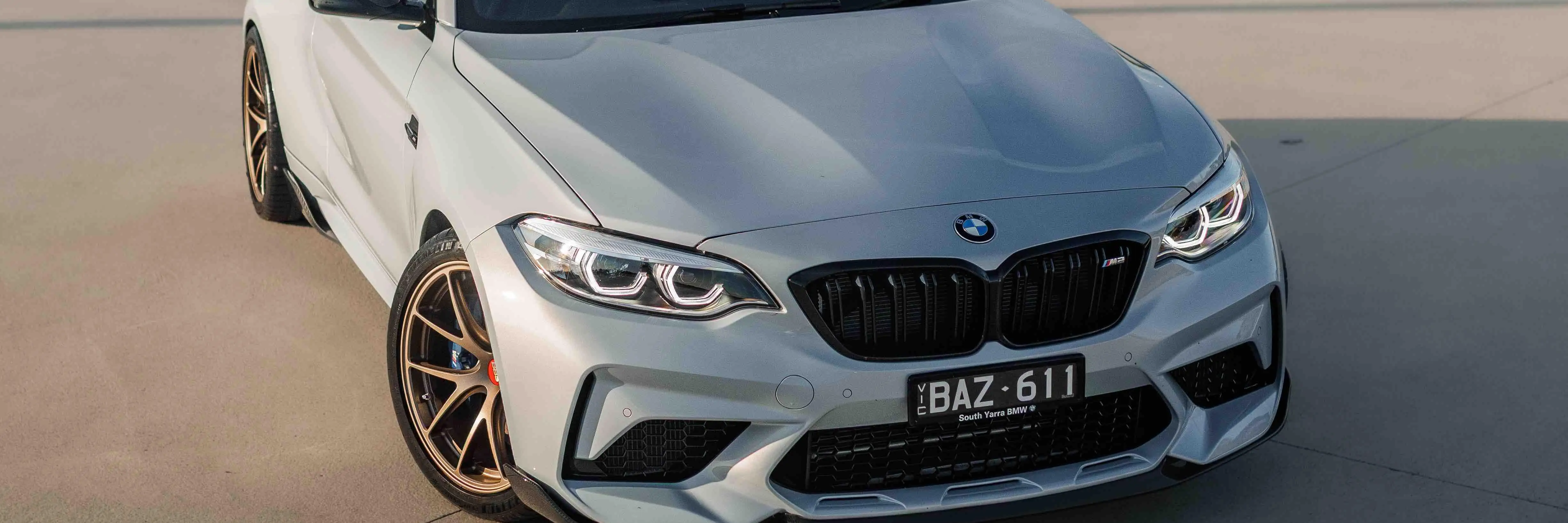 BMW F87 M2 coupe featuring a track inspired stance on Matte Bronze BBS RI-A forged wheels