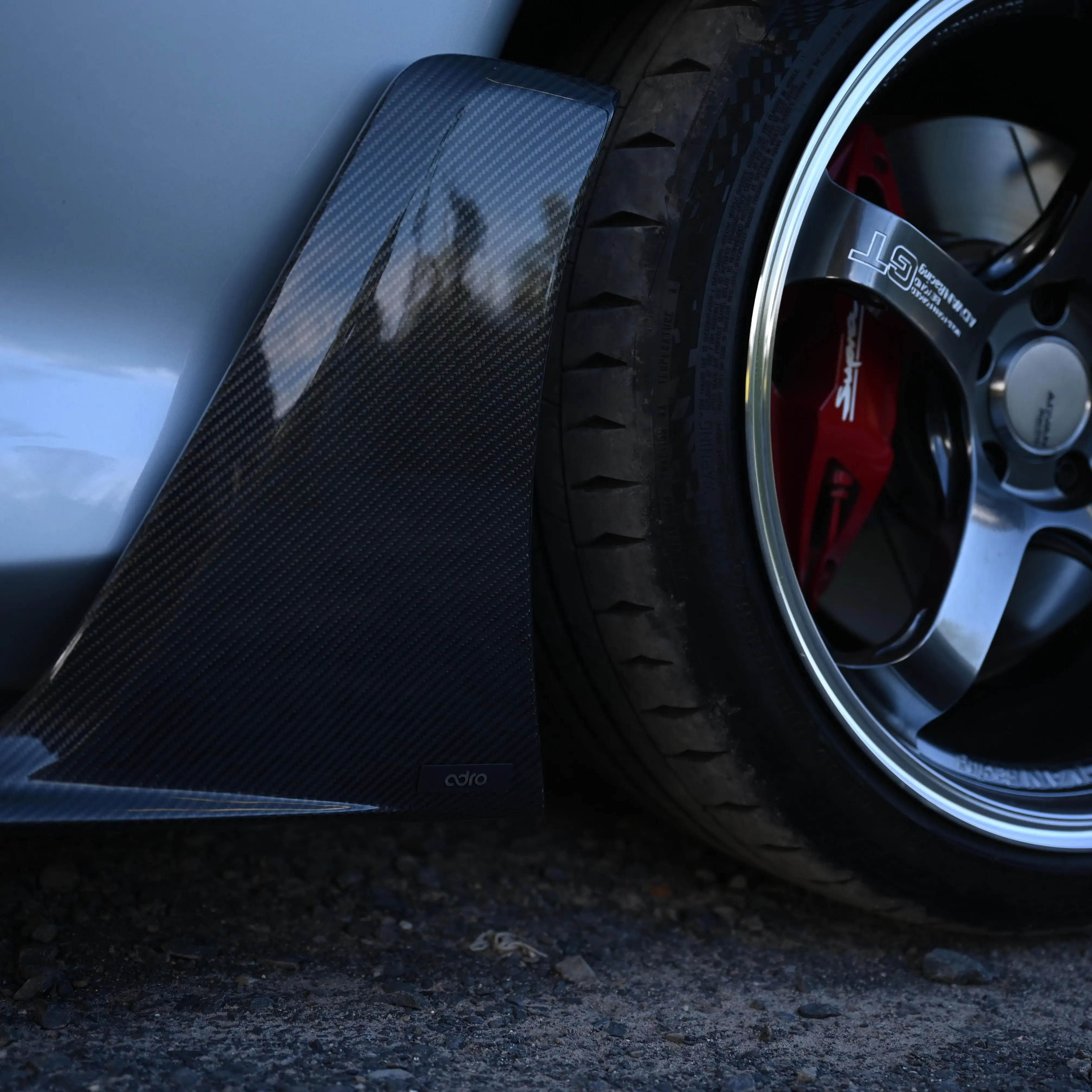 Close-up of 19-inch Advan GT Beyond wheel in Hyper Platinum Black highlighting Brembo brakes on Toyota GR Supra