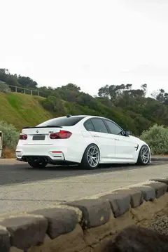 Detailed look at the aggressive wheel arch fitment and meaty tire setup on a Diamond Silver F80 M3 BBS RIA wheel
