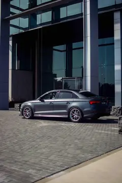 Low angle dynamic shot of a lowered Audi RS3 equipped with BBS RIA forged aluminum wheels