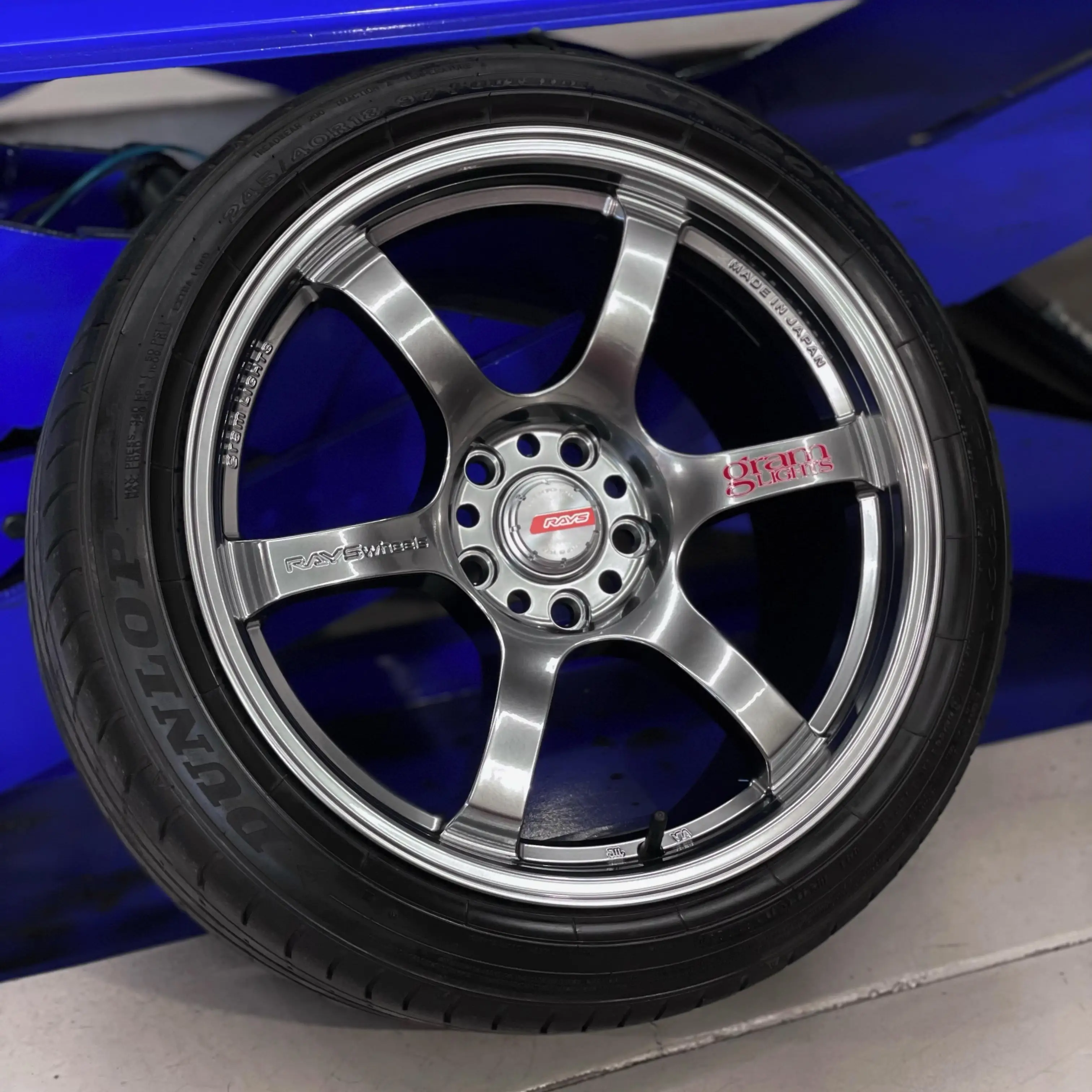 Rear quarter angle emphasizing the deep concave spoke profile of the 57DR wheel on a lowered white Toyota 86