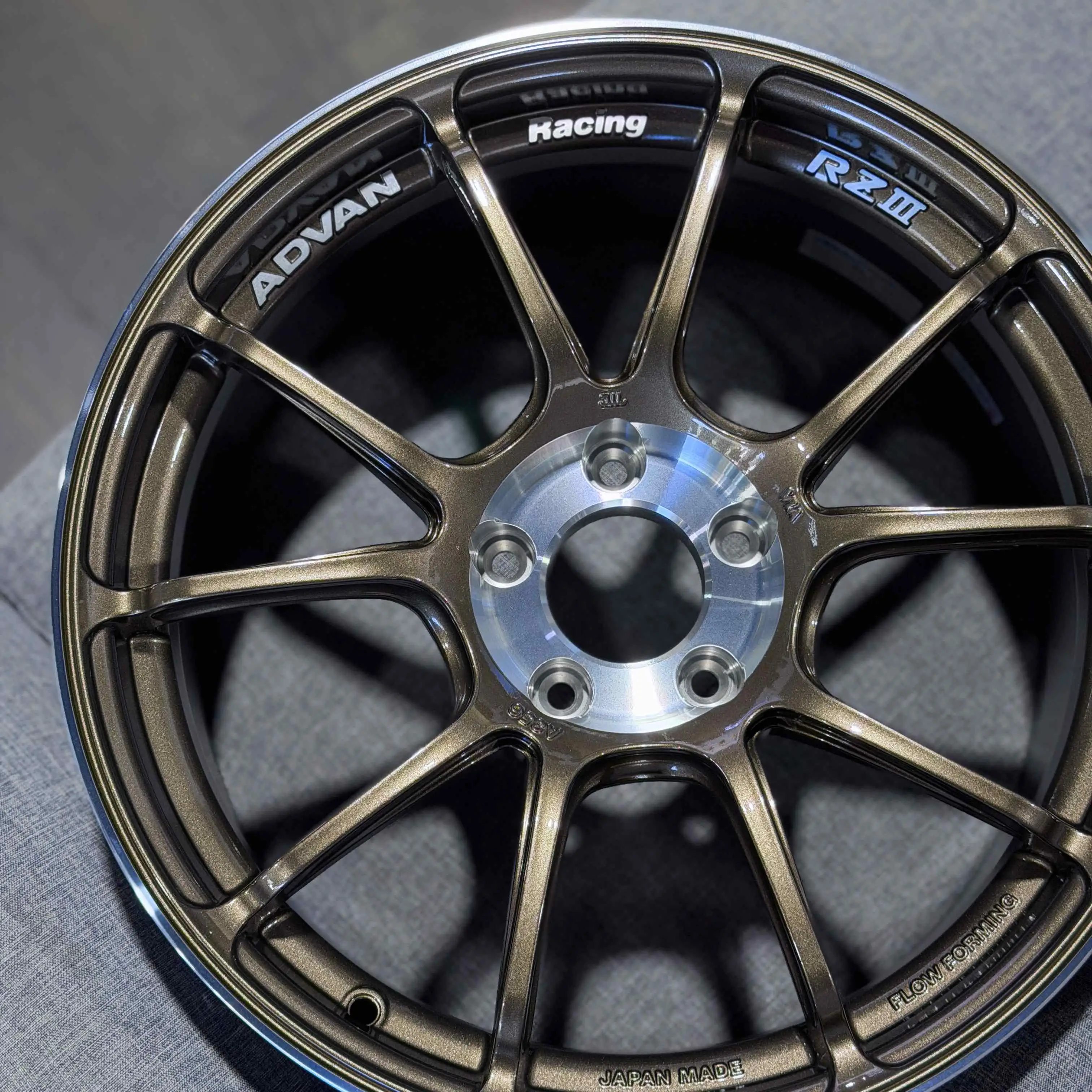 Three quarter studio view highlighting the deep concave GTR face spoke design of an Advan RZ3 wheel