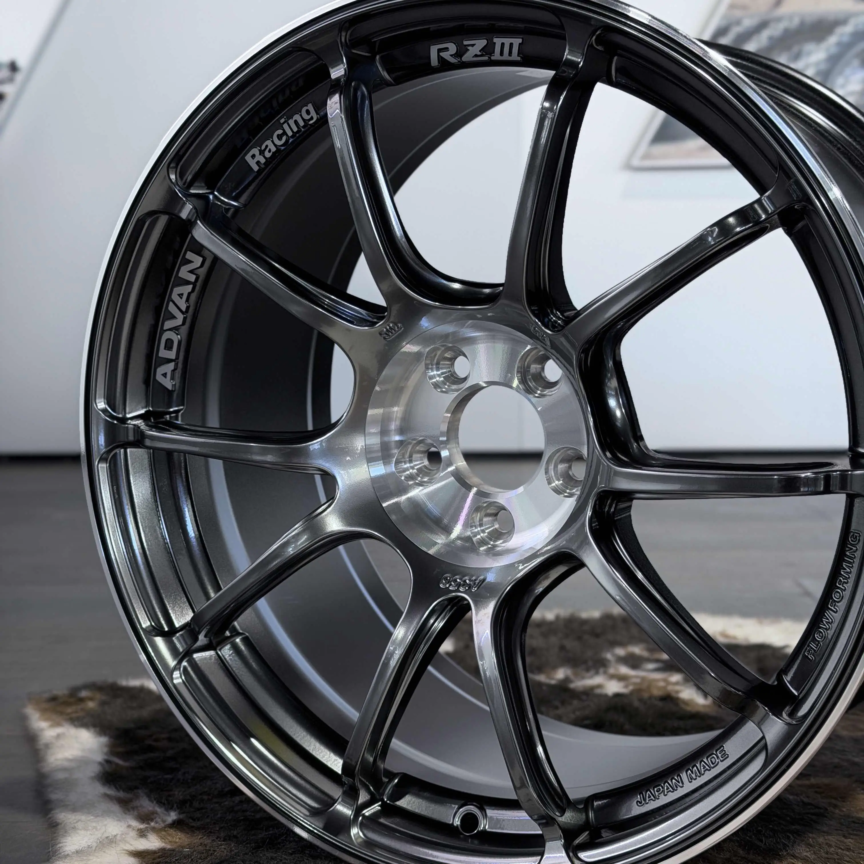 Three quarter showcasing the extreme concave Super GTR face profile of an Advan RZ3 wheel