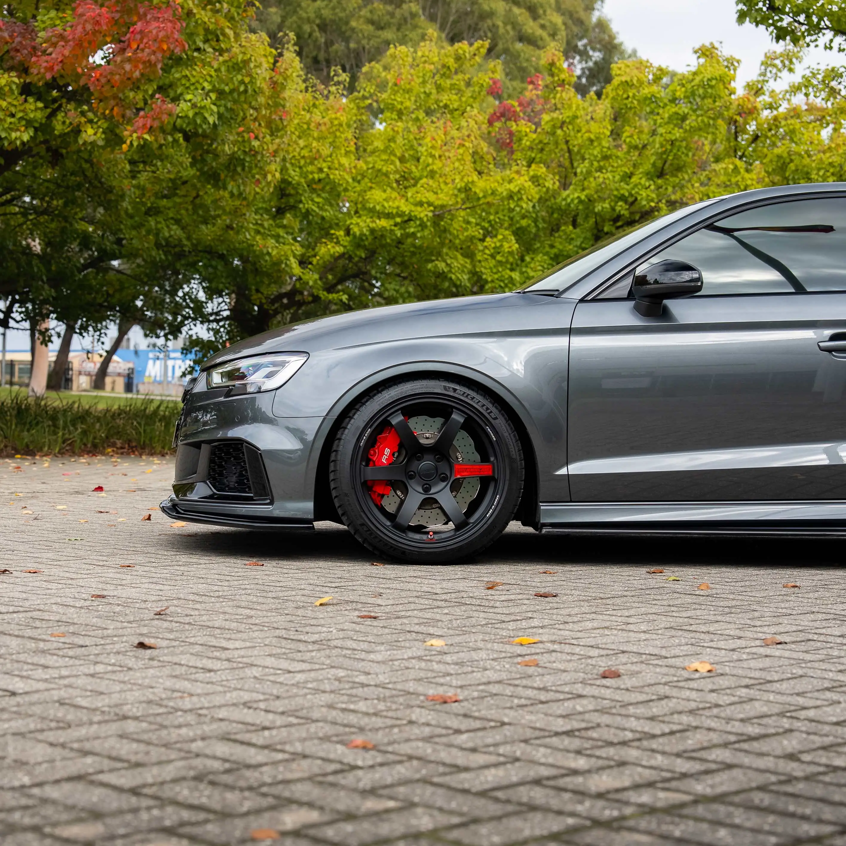 Daytona Grey Audi RS3 8V sedan featuring matte black RAYS Volk Racing TE37 Saga SL forged wheels in 18x9.5 +45 close up