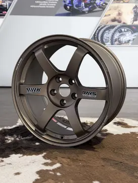close up highlighting the rigid spoke design and deep drop center of a Matte Gun Bronze TE37 Saga SL
