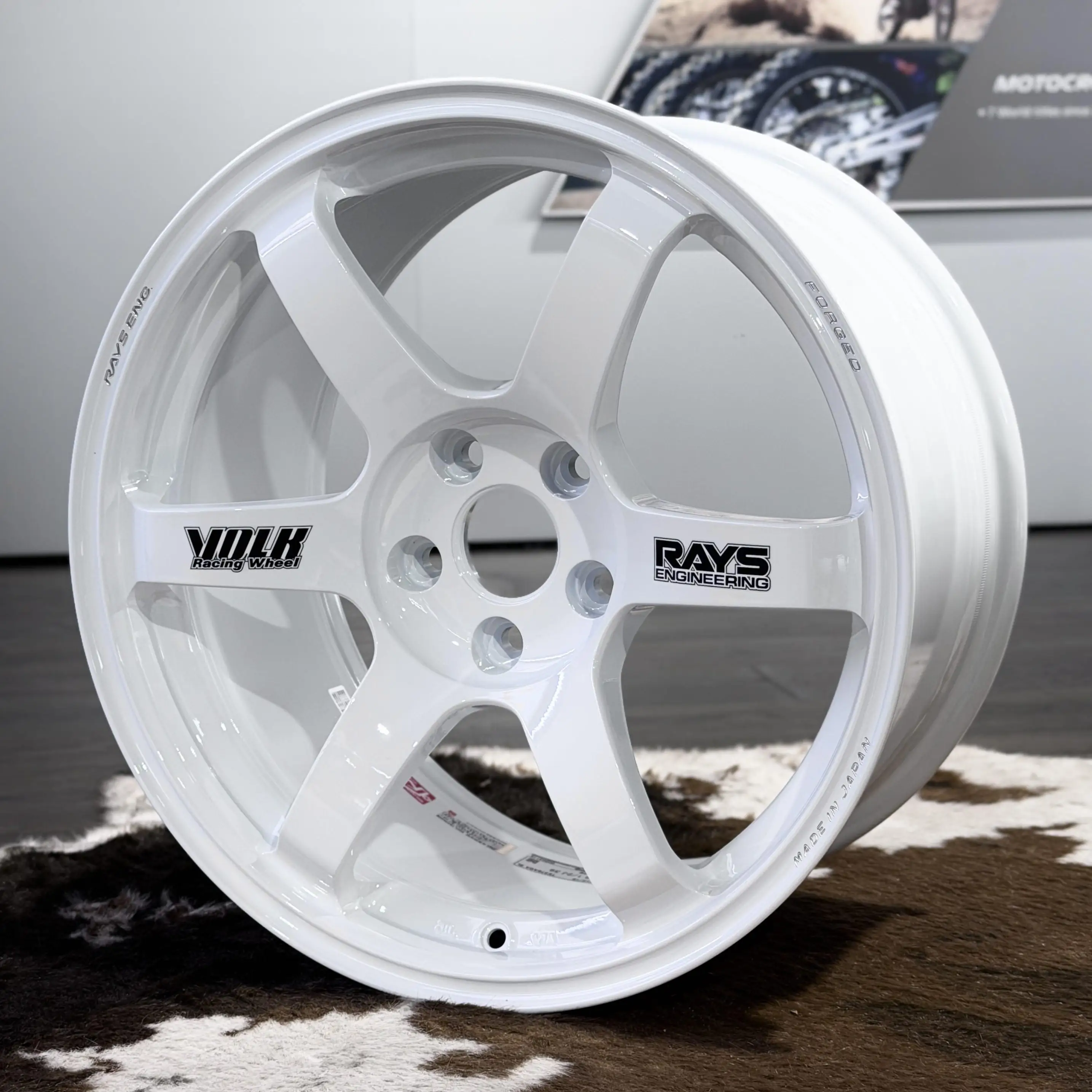 Full front profile of an 18 inch white RAYS Volk Racing TE37 Saga SL wheel featuring original black spoke stickers