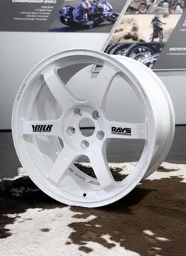 Full front profile of an 18 inch white RAYS Volk Racing TE37 Saga SL wheel featuring original black spoke stickers