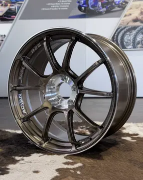 Detailed product shot capturing the clean capless central hub area and crisp cast lettering on track spec wheel