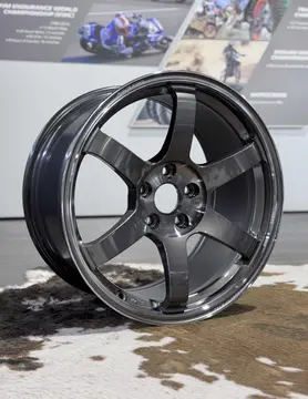 Low angle dynamic view focusing on the deep center drop of an 18 inch Pressed Graphite TE37 Saga SL