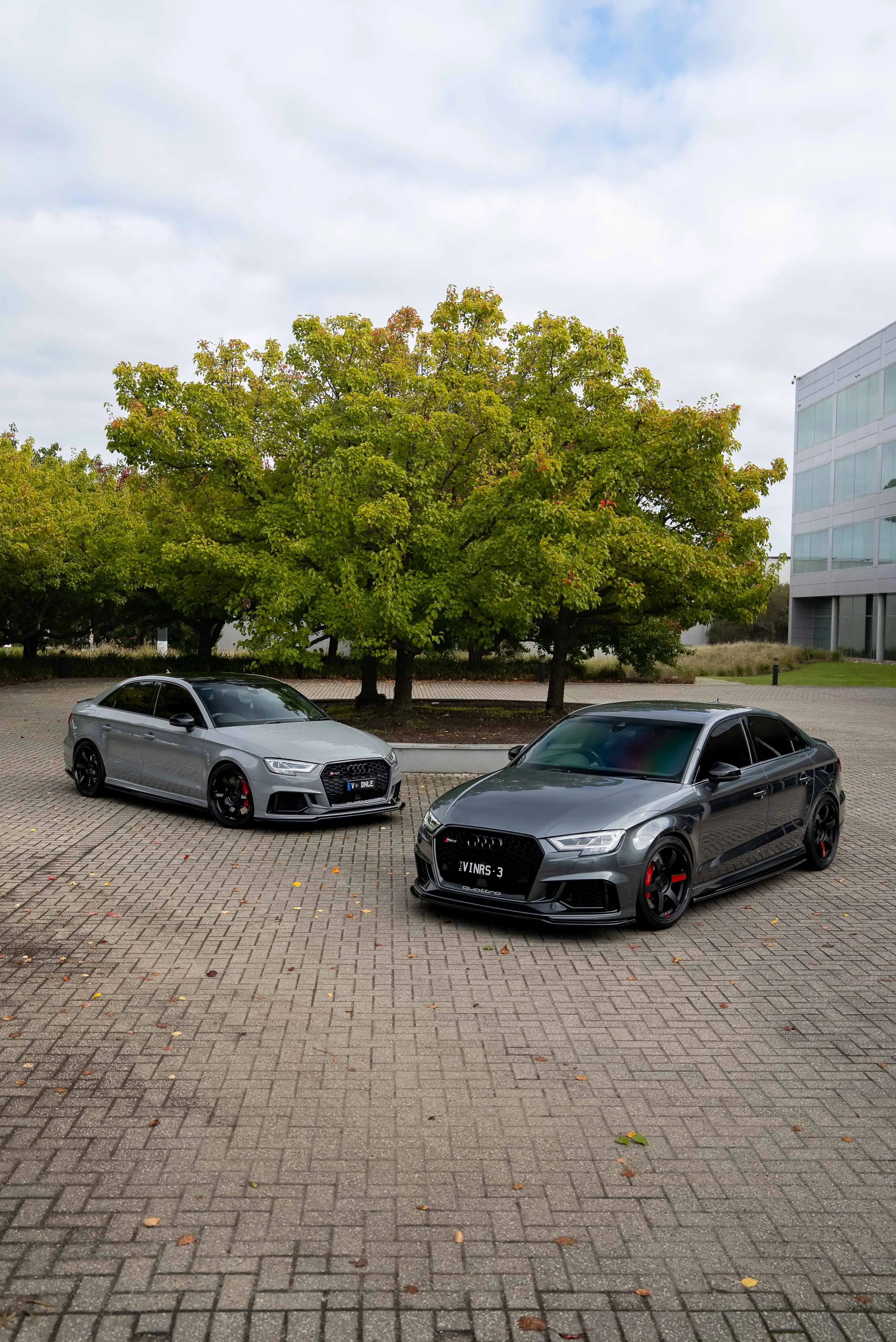 Audi RS3 8V sedans fitted with gloss and matte black RAYS Volk Racing TE37 Saga SL wheels protrait front and rear in australia