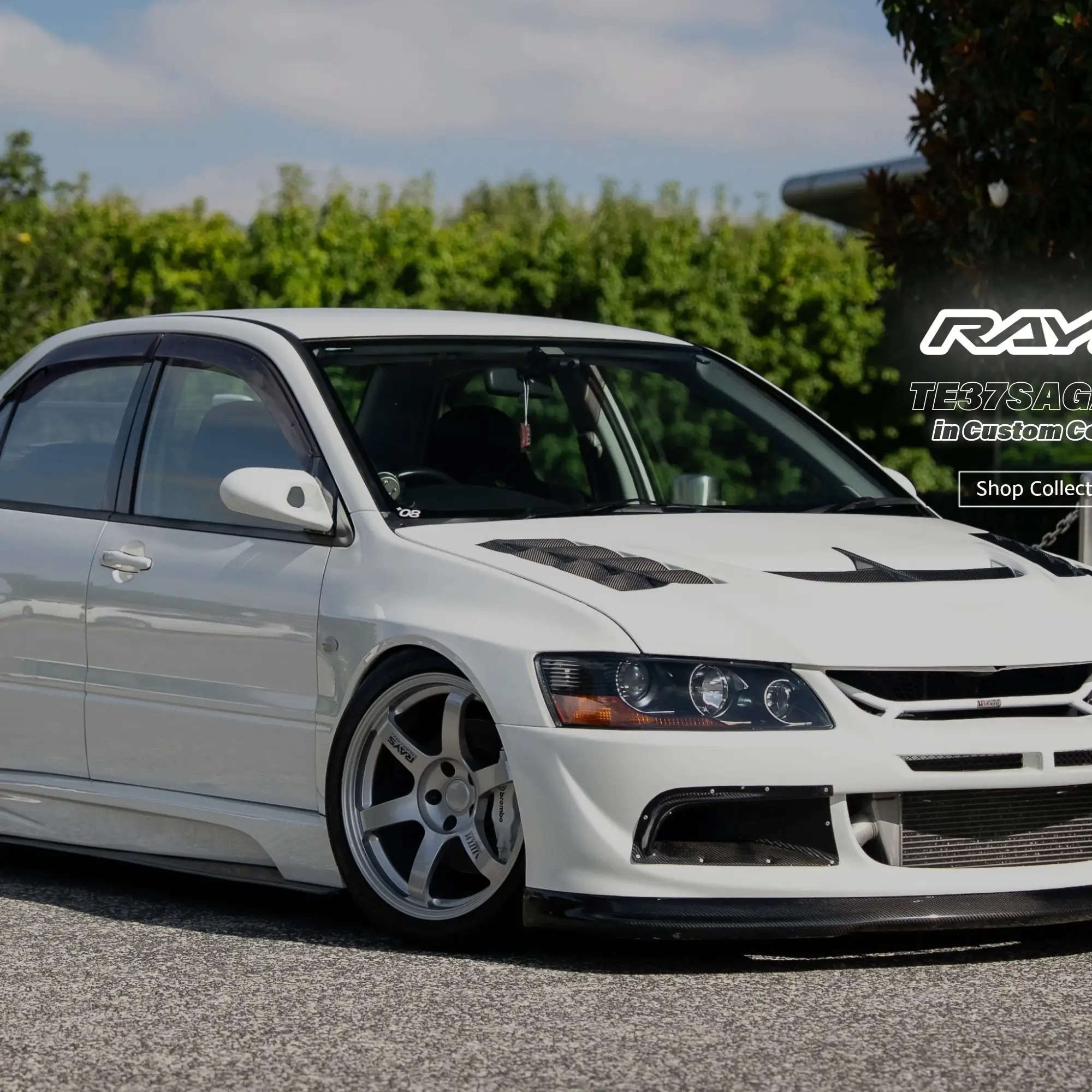 White Mitsubishi Lancer Evolution IX fitted with authentic lightweight silver RAYS TE37 wheels