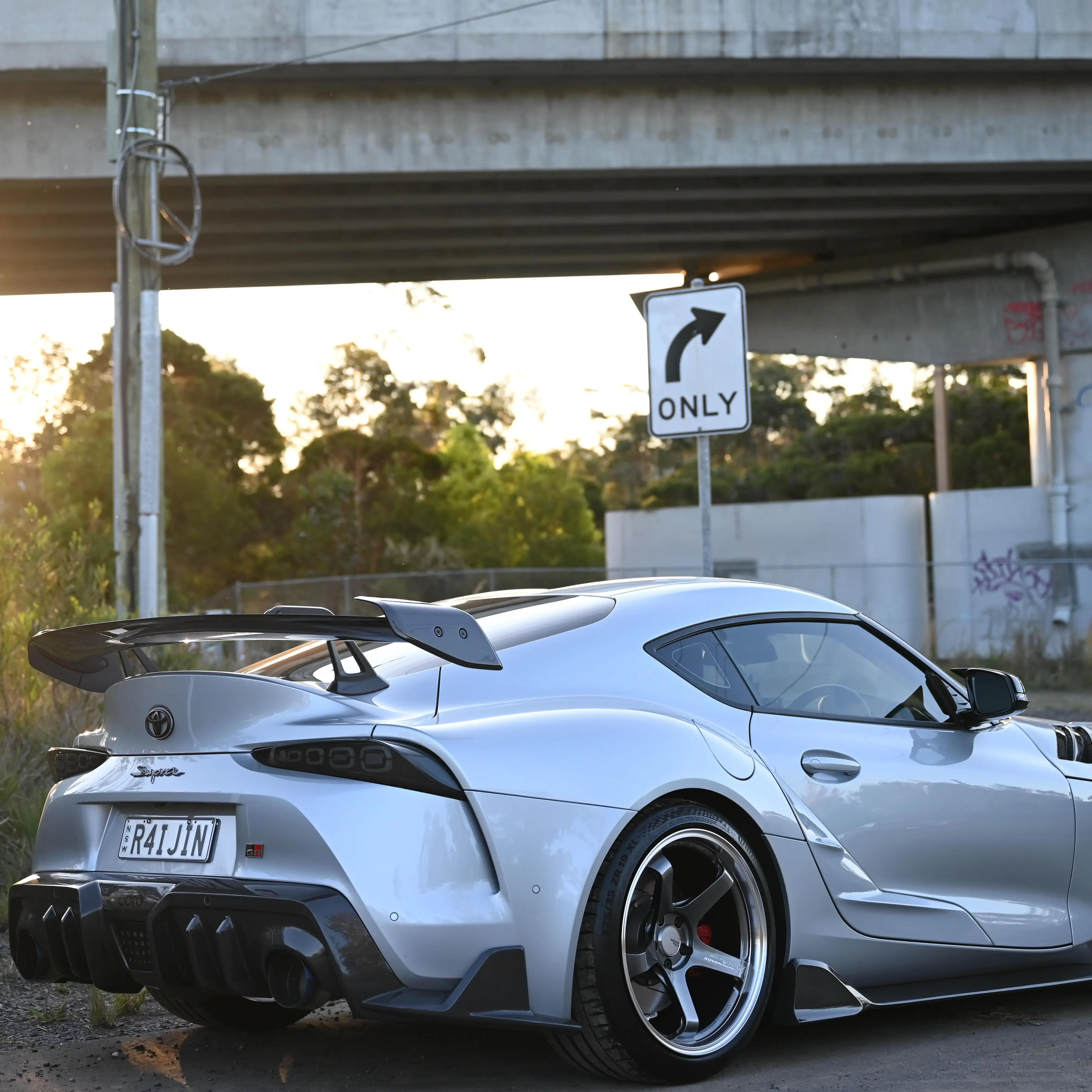 Toyota GR Supra on the move rolling on 19-inch Advan Racing GT Beyond Hyper Platinum Black wheels
