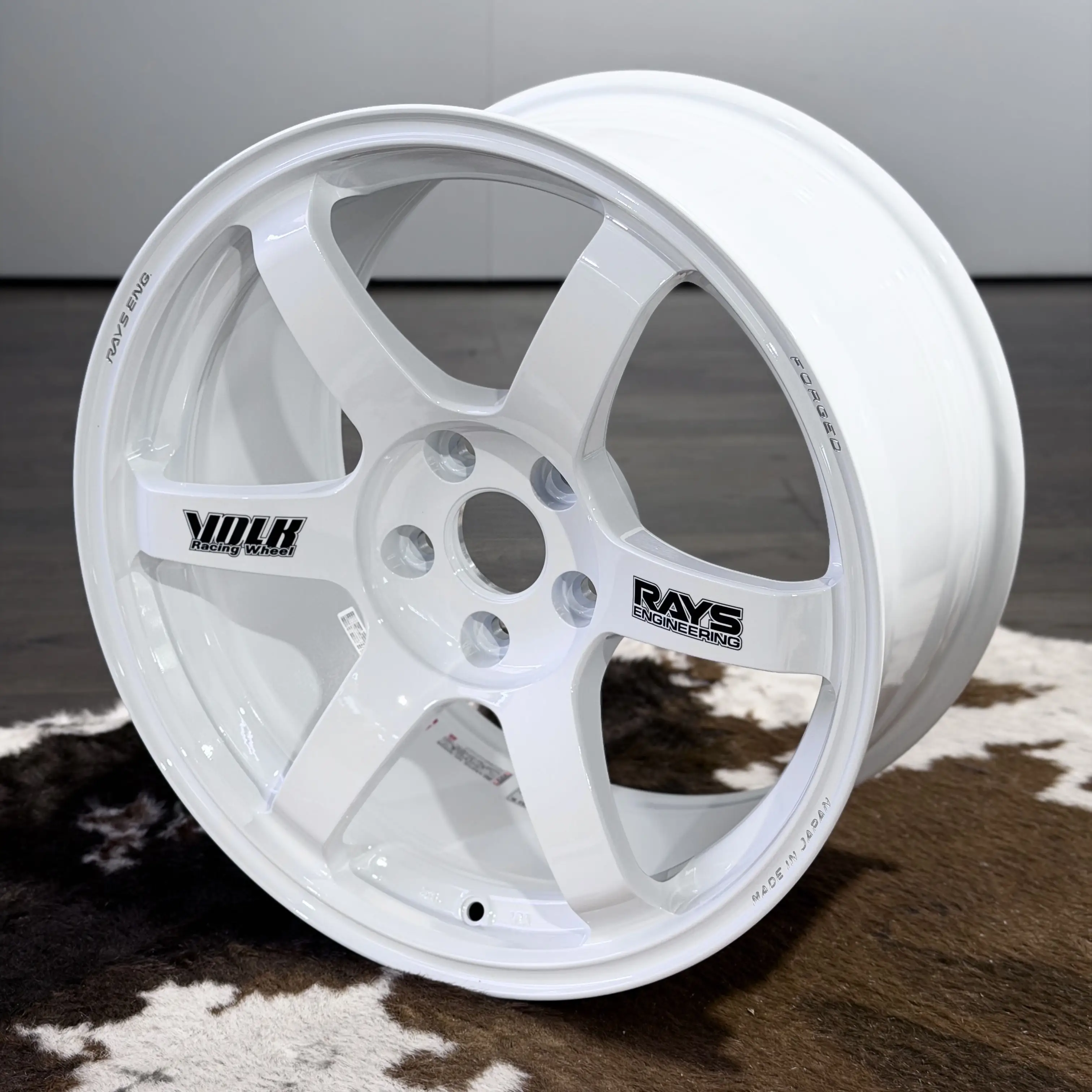 Showroom showcase of the Japanese made 18 inch Volk Racing TE37 Saga SL in white with black OG volk stickers