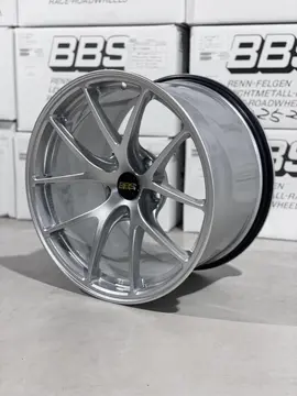 Three quarter studio perspective highlighting the split five spoke design of a Diamond Silver BBS RIA racing wheel