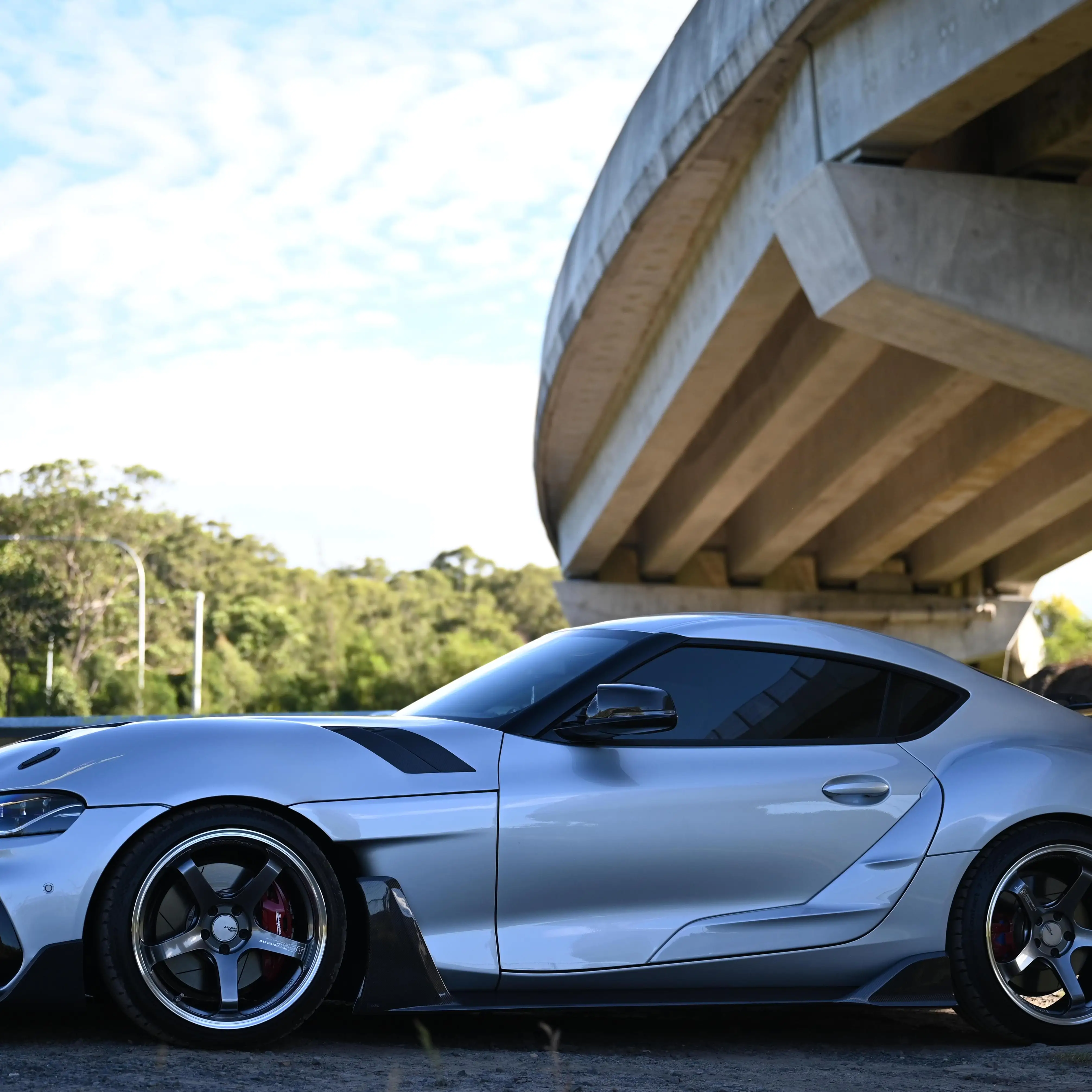 side shoot of a90 mk5 gr supra running advan gt beyond in hyper platinum black