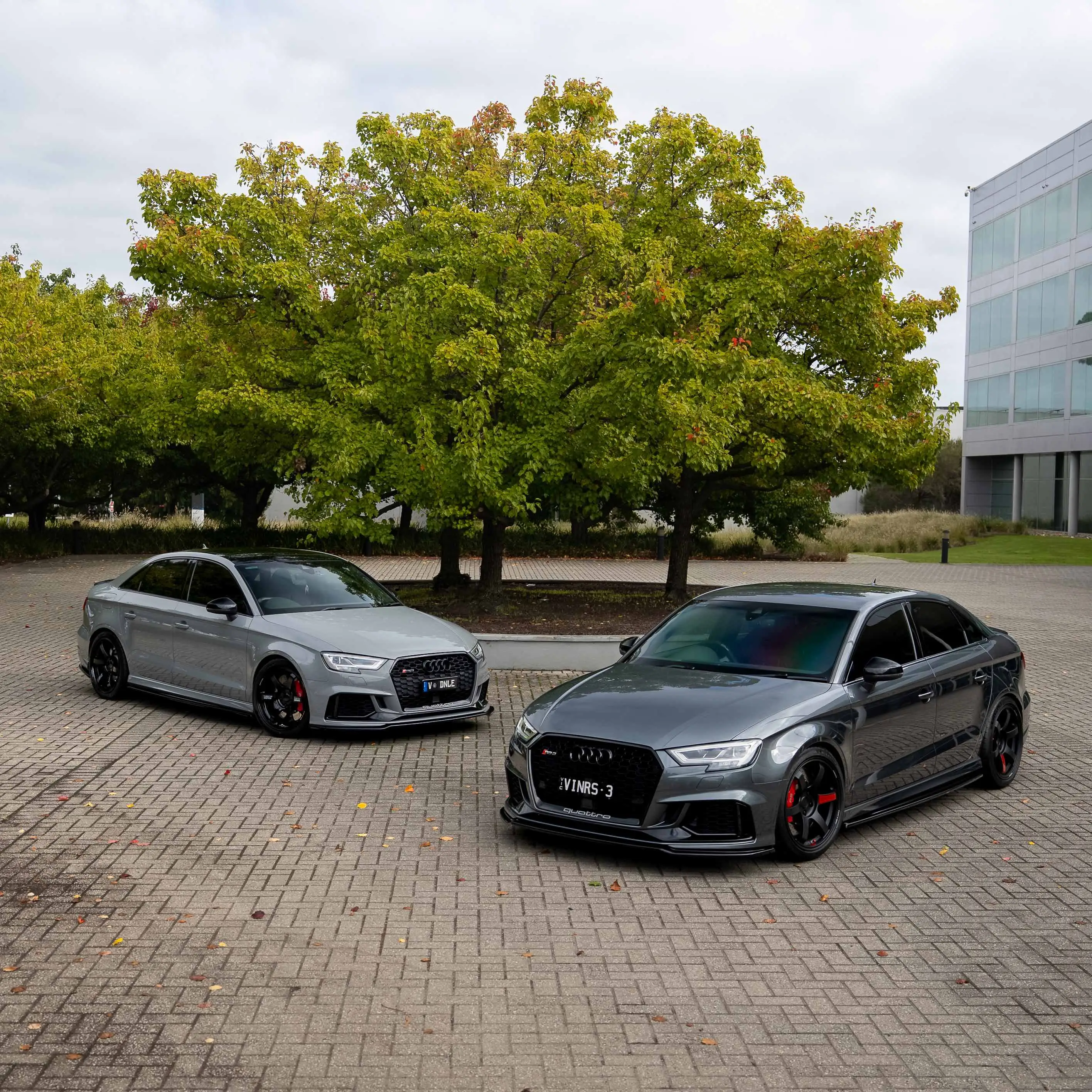 Audi RS3 8V sedans fitted with gloss and matte black RAYS Volk Racing TE37 Saga SL wheels protrait front and rear in australia