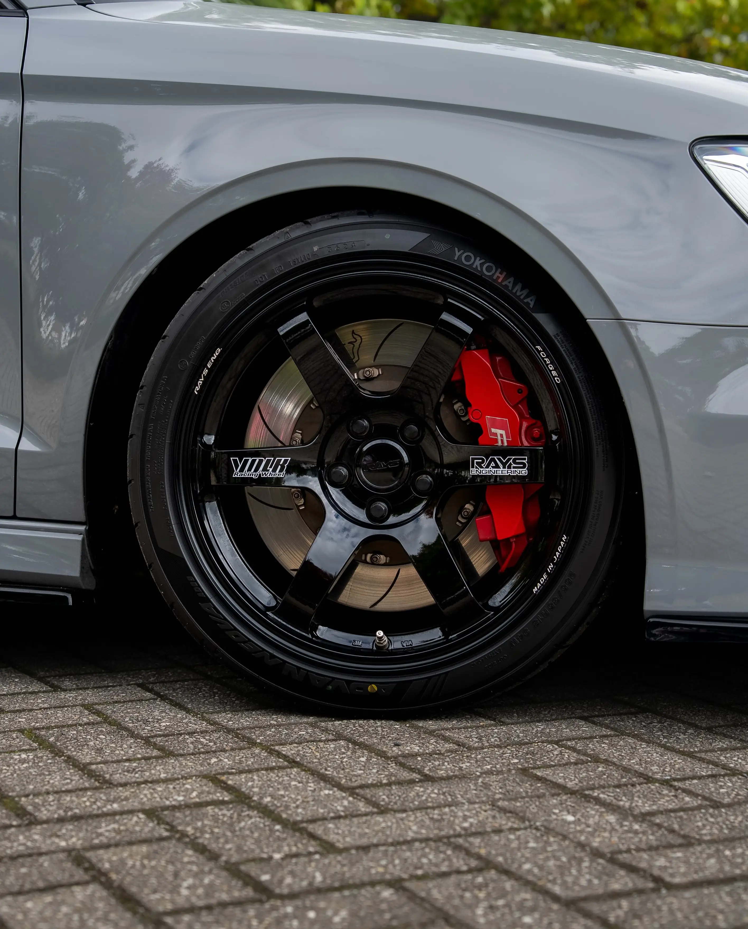 Nardo Grey Audi RS3 8V sedan fitted with gloss black RAYS Volk Racing TE37 Saga SL wheels in 18x9.5 +45 spec