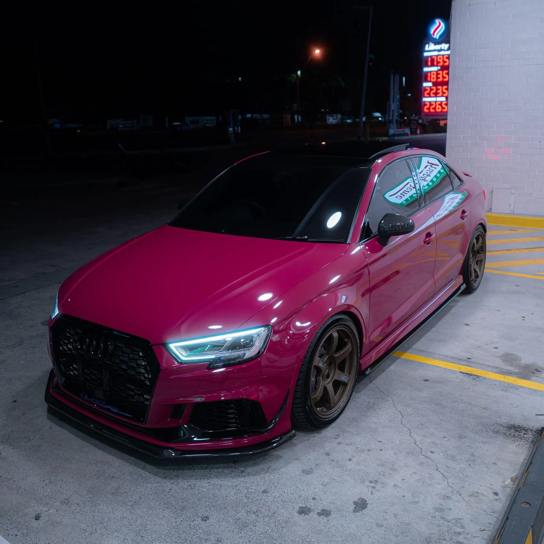 Ruby Star Pink Audi 8V RS3 Sedan side view fitted with Matte Gun Bronze RAYS Volk Racing TE37 SAGA SL wheels - KA Autosport Australia