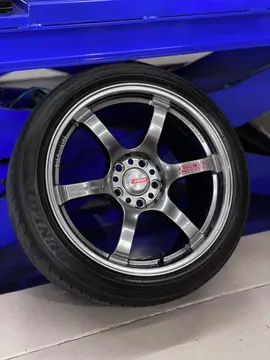 Rear quarter angle emphasizing the deep concave spoke profile of the 57DR wheel on a lowered white Toyota 86