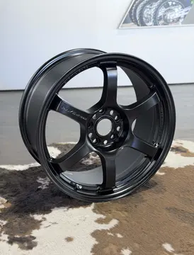Detailed product shot focusing on the clean lug pocket area and embossed RAYS branding on a 57DR wheel