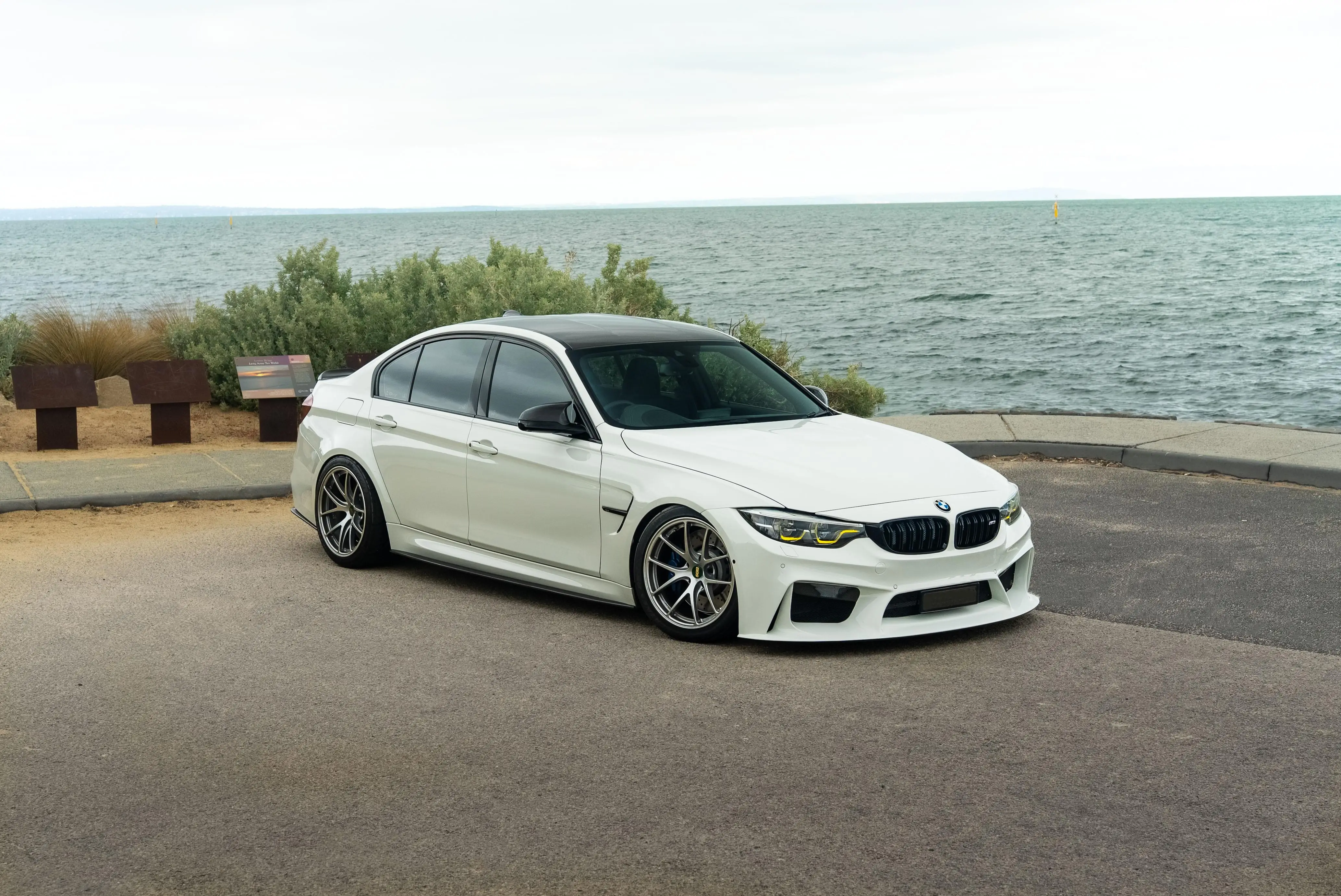 White BMW F80 M3 sedan sitting on track spec BBS RI-A forged wheels in Diamond Silver