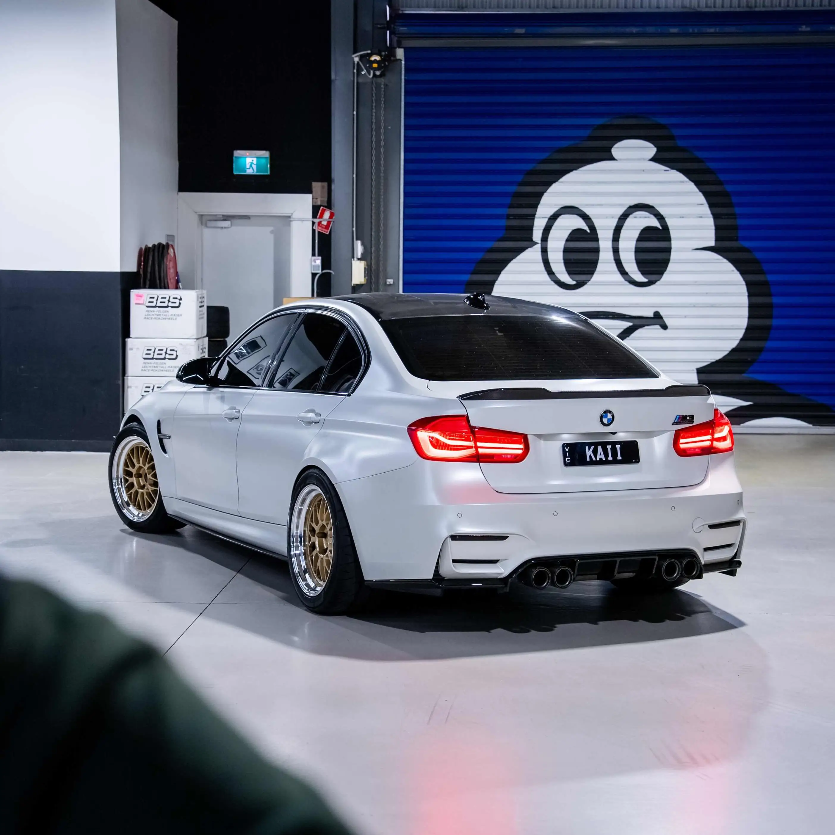 Alpine White BMW F80 M3 sedan fitted with Volk Racing 21A wheels featuring Gold face and polished silver rim