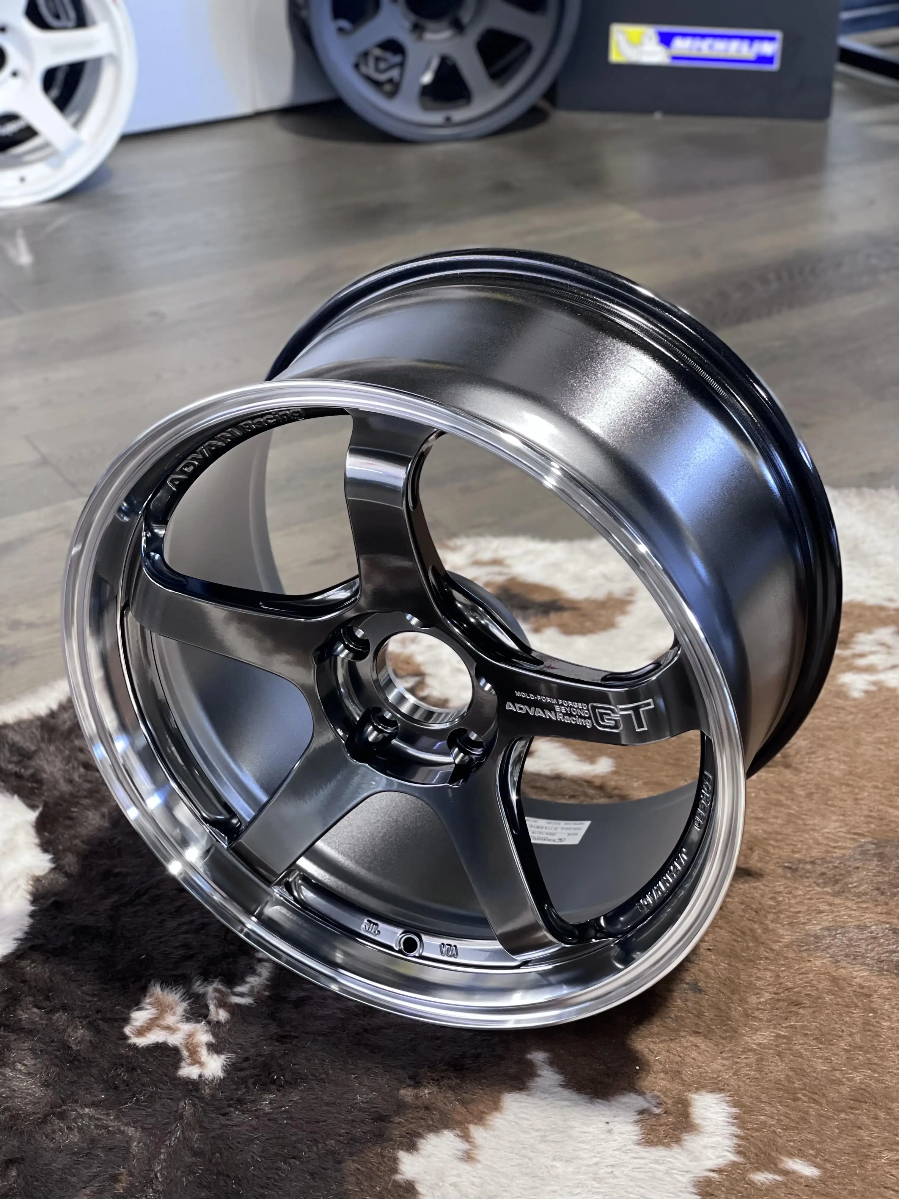 Side perspective emphasizing the bright diamond cut machined outer lip contrast on a Hyper Platinum Black Advan wheel