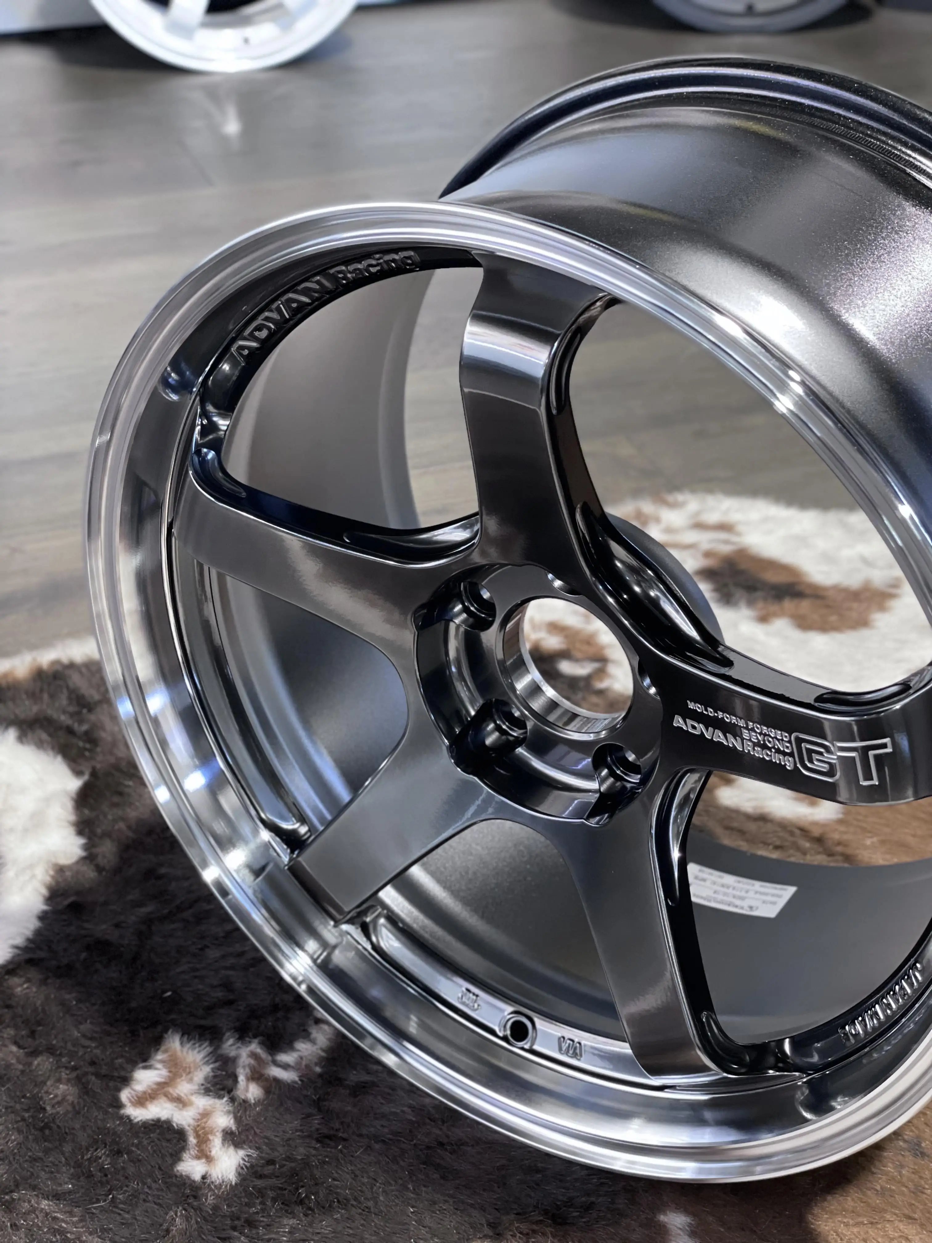 Angled shot illustrating the rigid fixed depth barrel rim design and anti tire slip knurling of a track ready Advan wheel