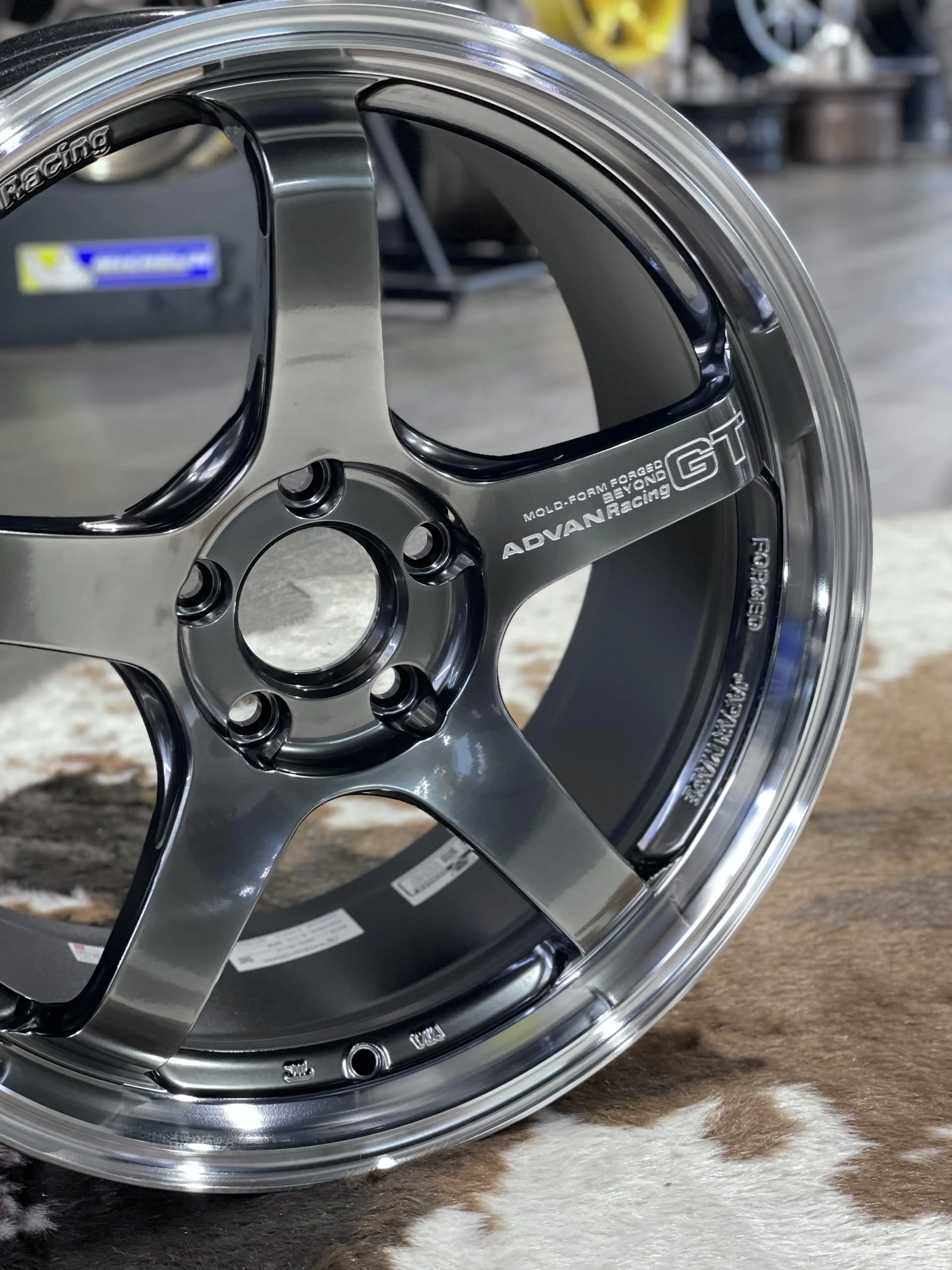 Detailed product shot showcasing the dark mirror reflections and premium deep metallic luster of a standalone MPB wheel