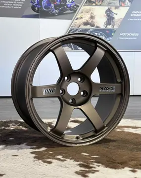 Close-up of 30th Anniversary logo engraved on the outer lip of Bronze RAYS Volk Racing TE37 SAGA S-Plus wheel