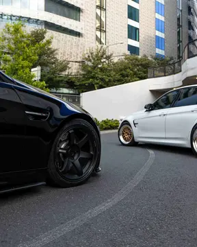 Aggressive three quarter view of black E92 M3 V8 coupe running 18 inch Matte Black TE37 Saga S-Plus fitment