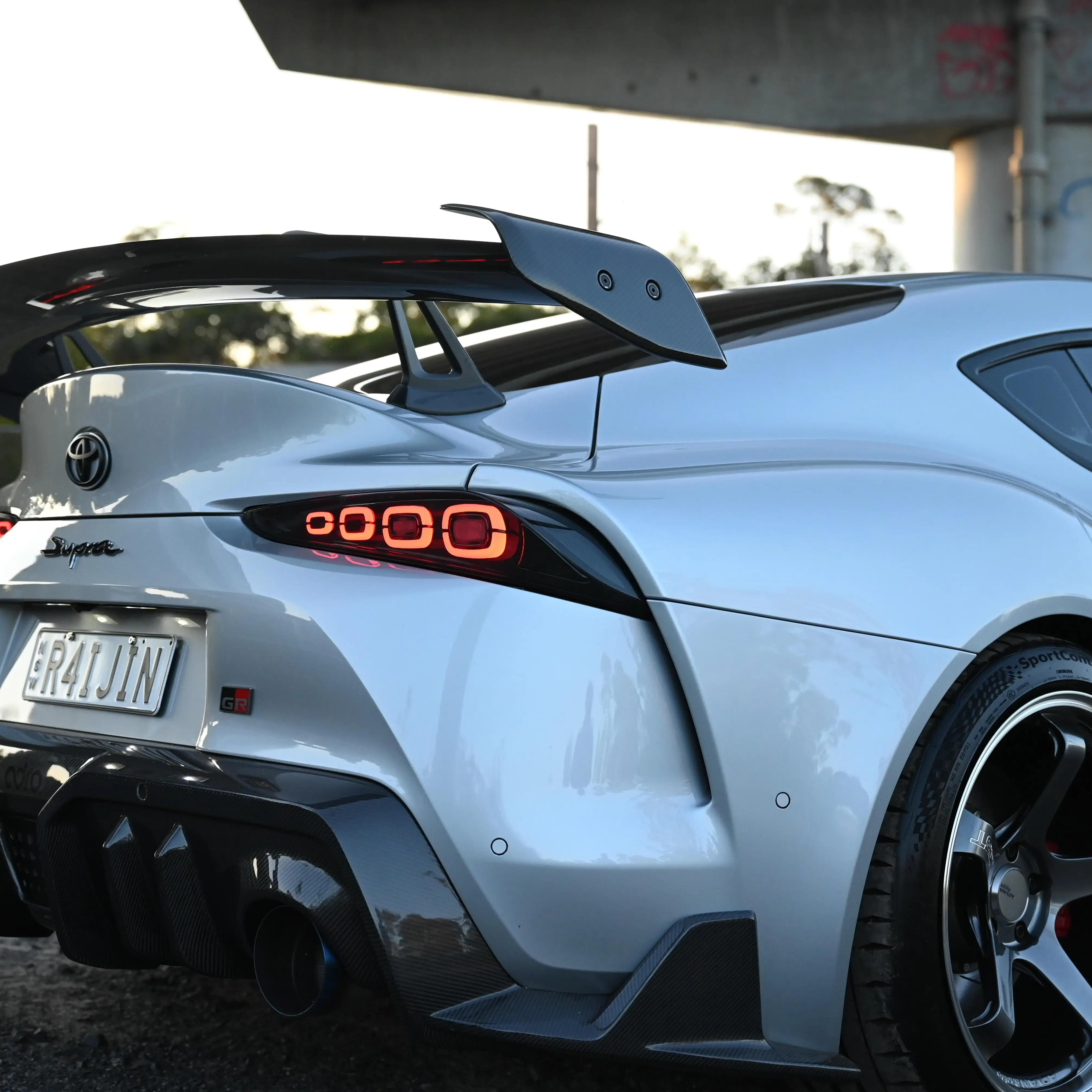Rear profile of Toyota GR Supra with staggered 19-inch Advan Racing GT Beyond wheels from KA Autosport