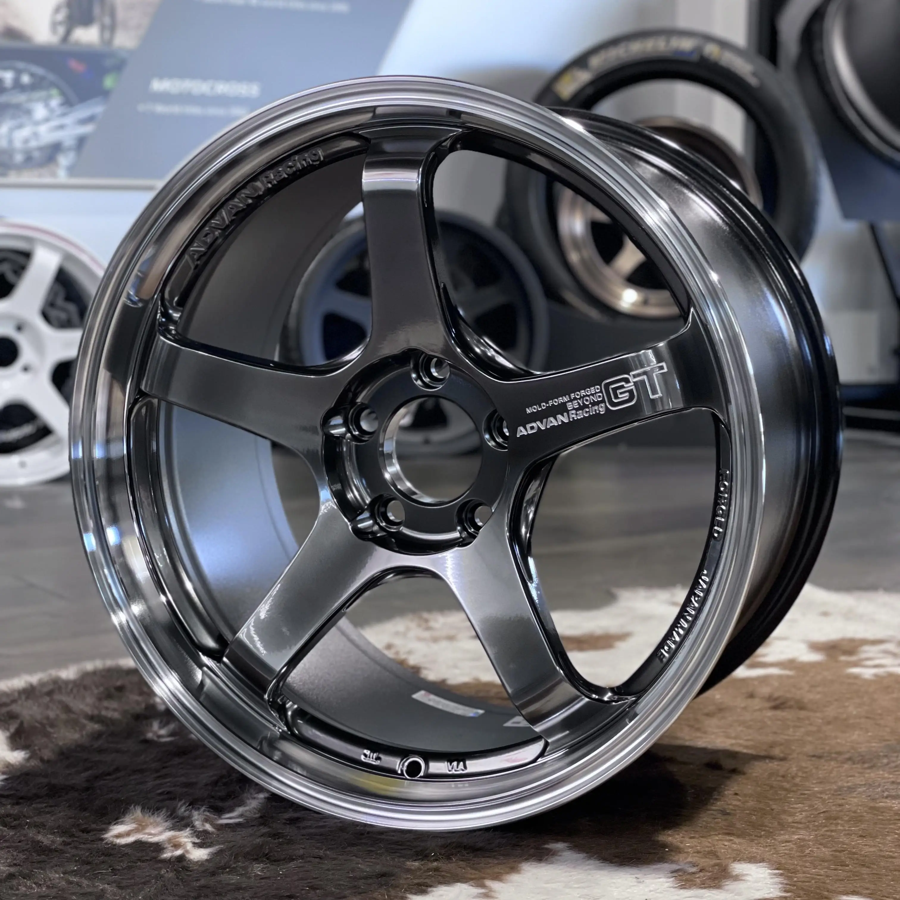 Angled shot illustrating the rigid fixed depth barrel rim design and anti tire slip knurling of a track ready Advan wheel