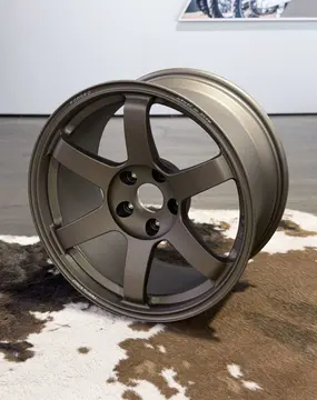Premium showroom showcase of the lightweight track spec 18 inch RAYS TE37 Saga SL in Matte Gun Bronze