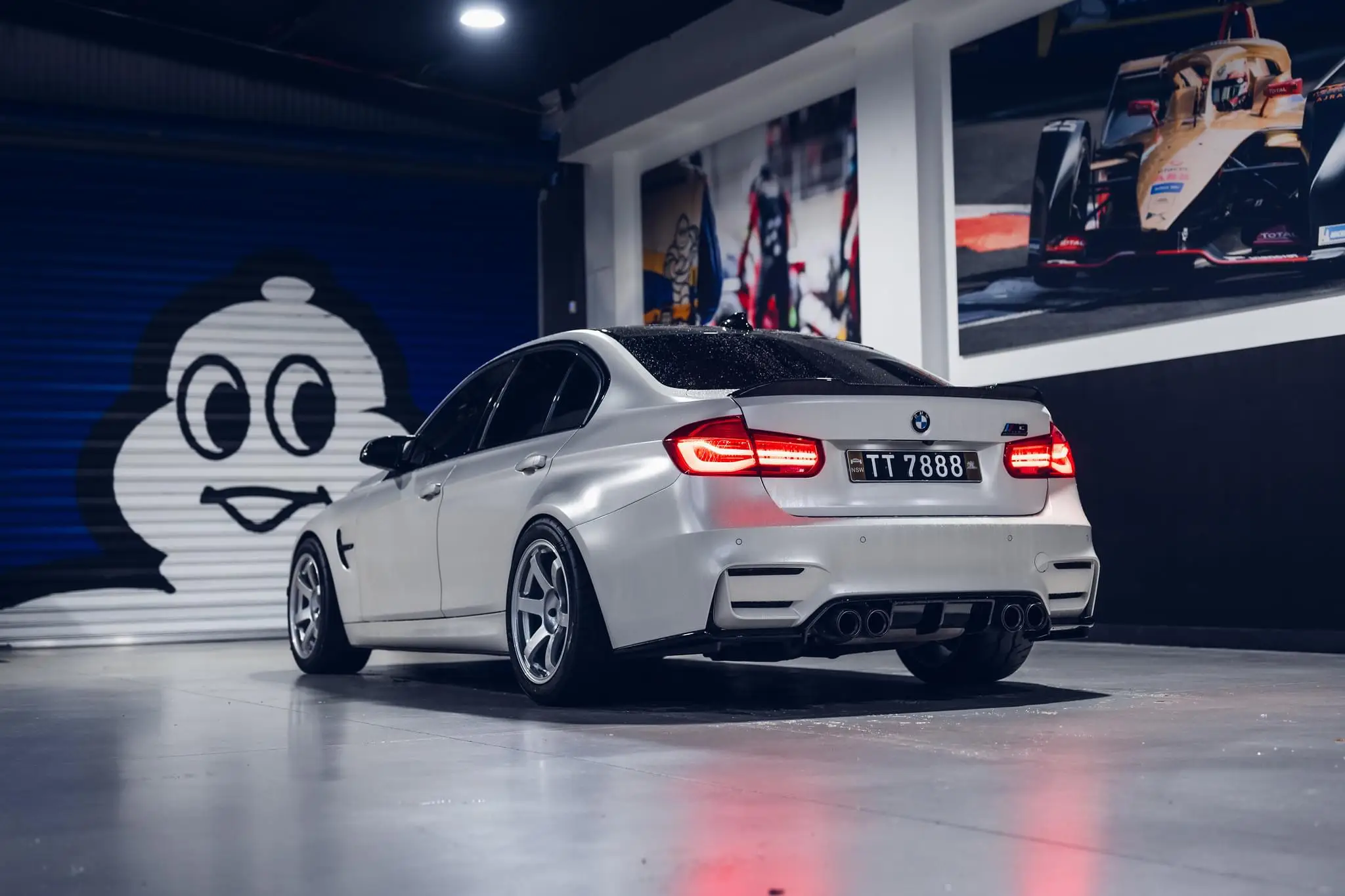 Side profile showing perfect flush fender fitment of Diamond Silver TE37 Saga S-Plus wheels on a white F80 M3