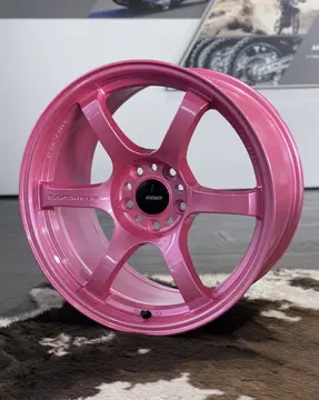Three quarter studio perspective highlighting the striking six spoke design of a Sakura Pink 57DR wheel