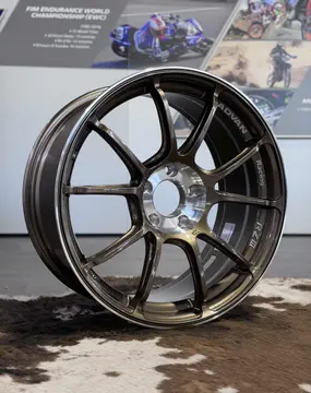 Side angle perspective focusing on the lightweight advanced side cut machining along the twin bronze spokes