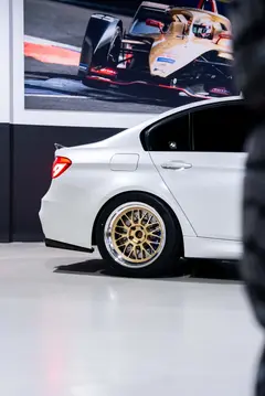 White BMW F80 M3 on hoist undergoing custom JDM wheel test fitment at KA Autosport Melbourne