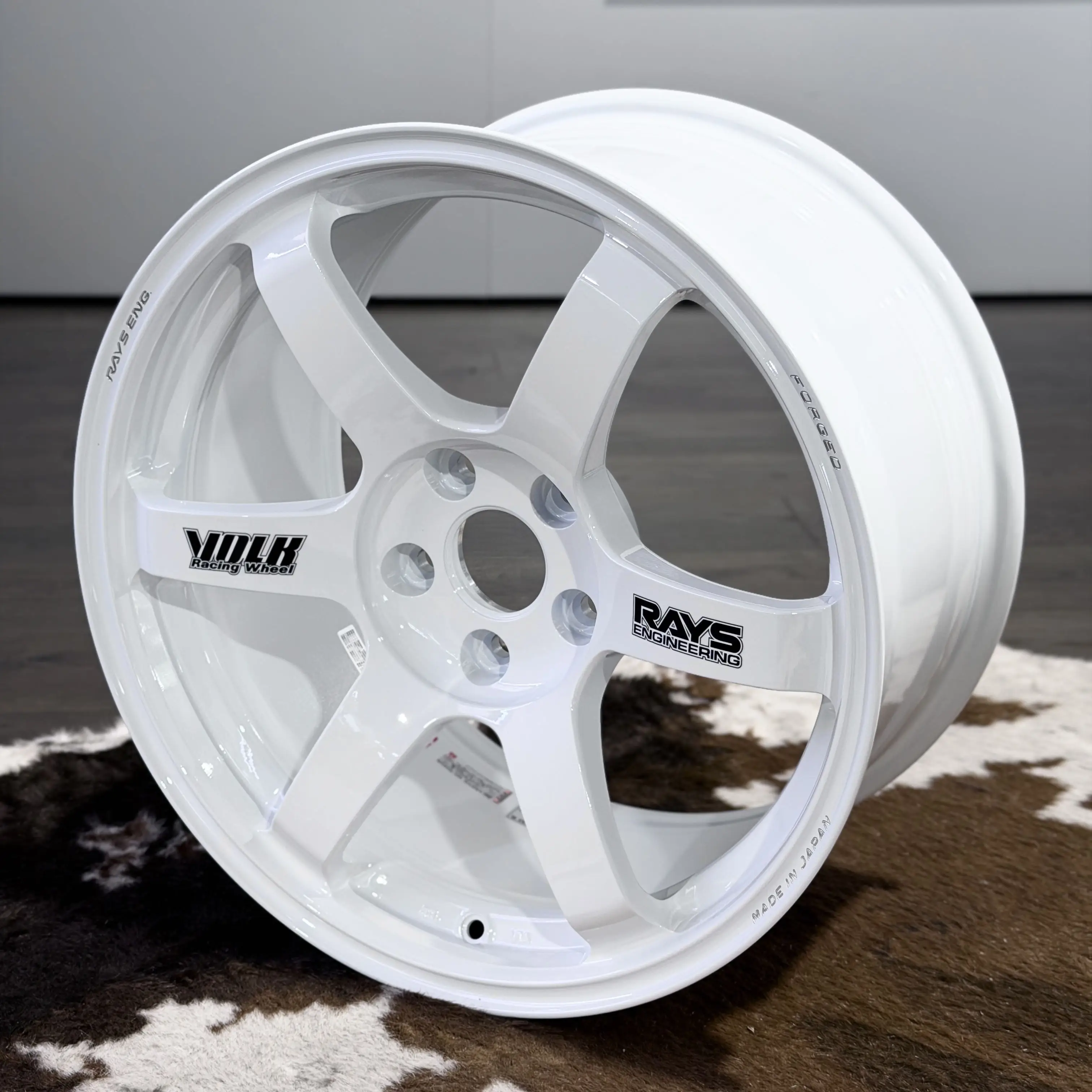 Showroom showcase of the Japanese made 18 inch Volk Racing TE37 Saga SL in white with black OG volk stickers