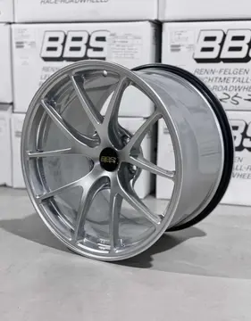 Three quarter studio perspective highlighting the split five spoke design of a Diamond Silver BBS RIA racing wheel
