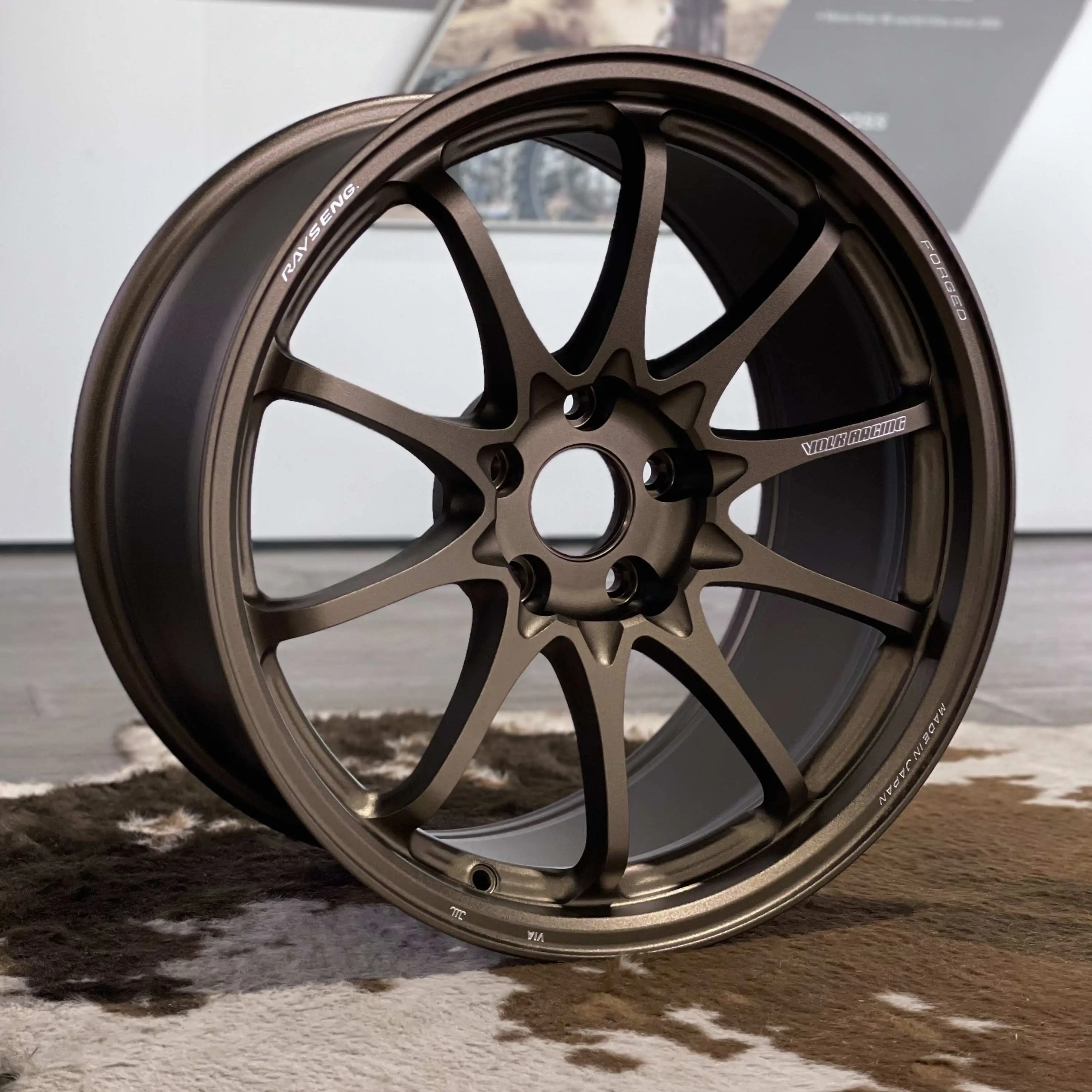 Full front face view of an 18 inch RAYS Volk Racing CE28 N-Plus wheel in anodized Bronze with aggressive Face 4 concavity
