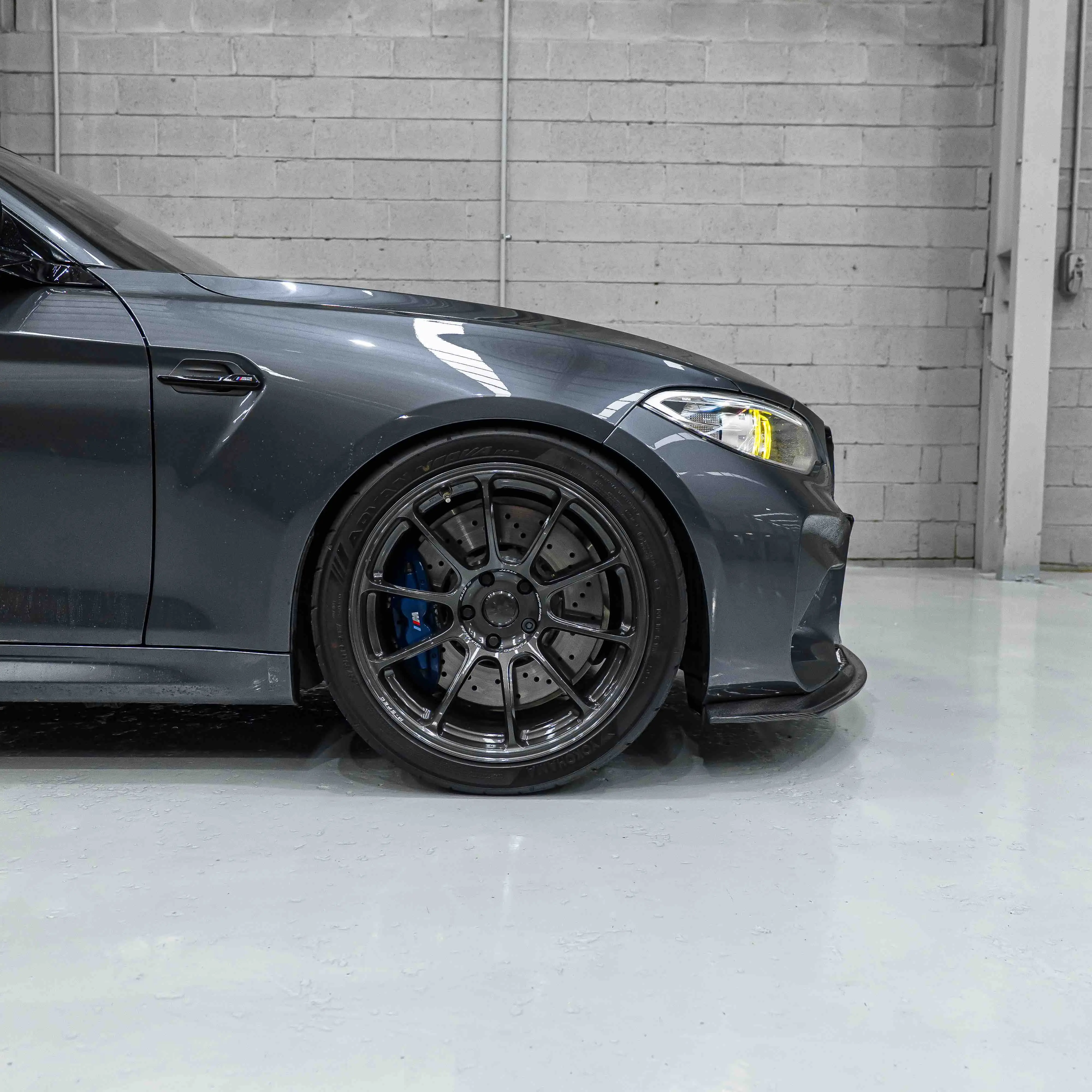 Close-up of front 19-inch RAYS Volk Racing ZE40 wheel in Diamond Dark Gunmetal on BMW F87 M2