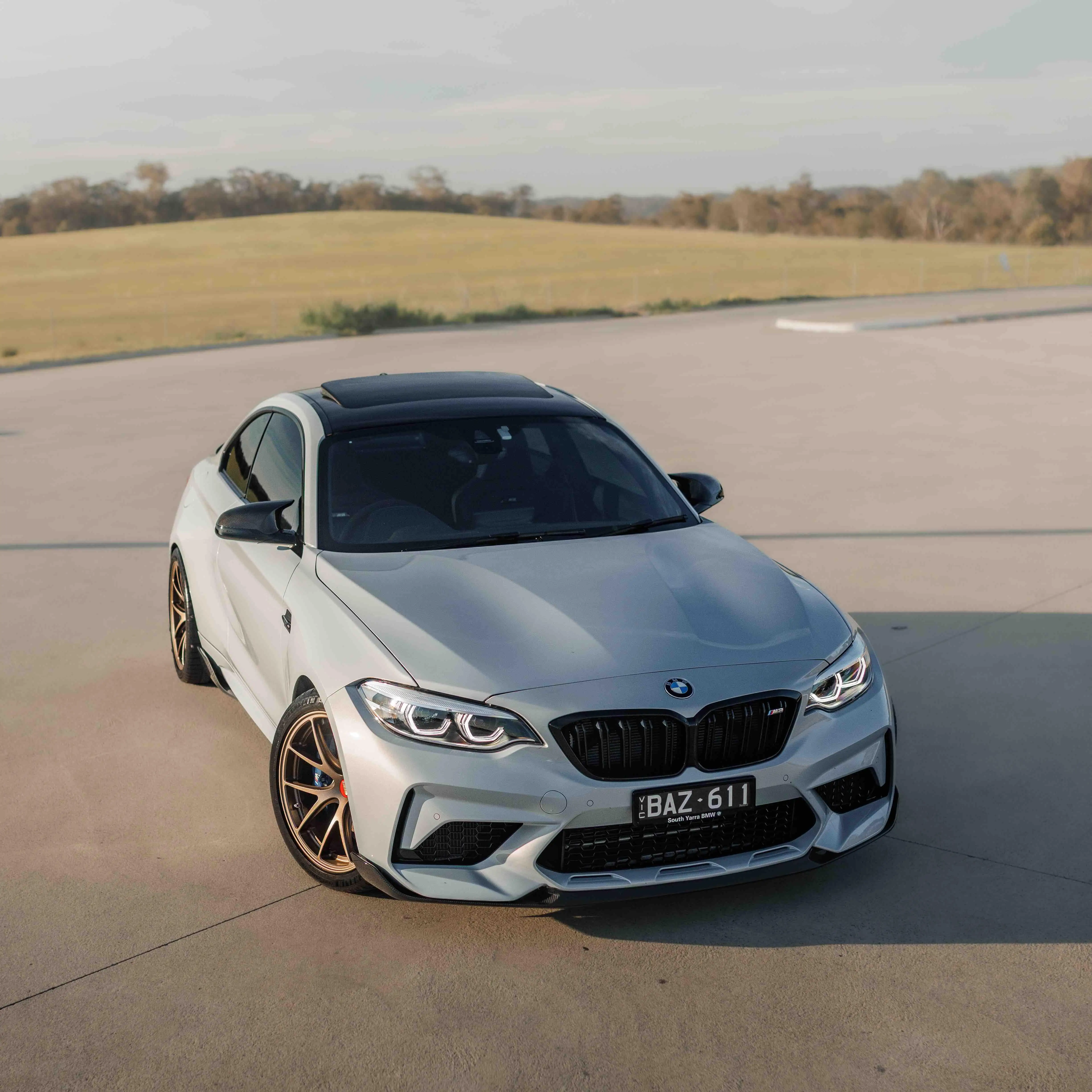 BMW F87 M2 coupe featuring a track inspired stance on Matte Bronze BBS RI-A forged wheels