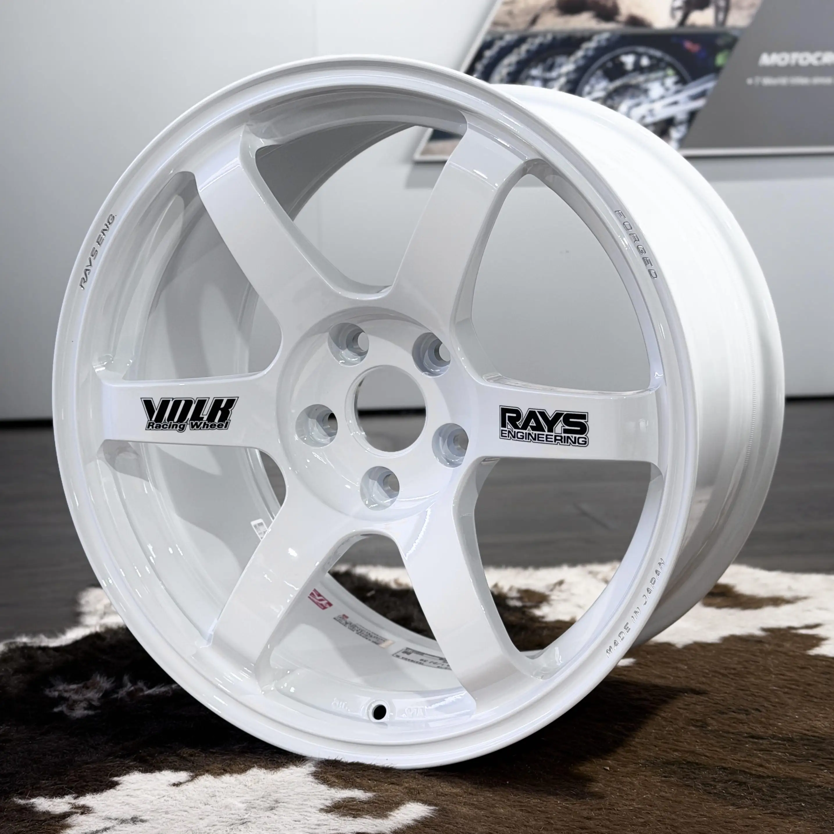 Full front profile of an 18 inch white RAYS Volk Racing TE37 Saga SL wheel featuring original black spoke stickers
