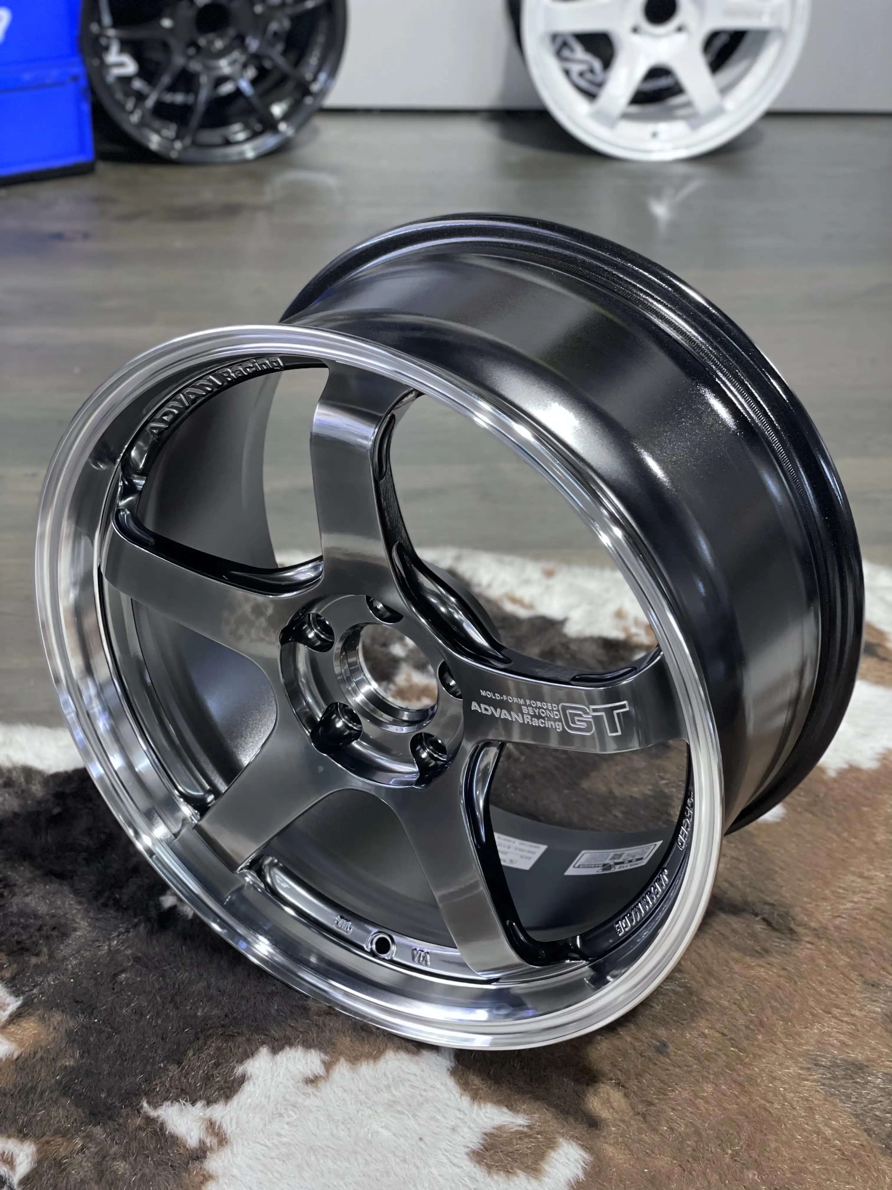 Studio display capturing the high end finish texture and liquid chrome aesthetics of an authentic Yokohama wheel