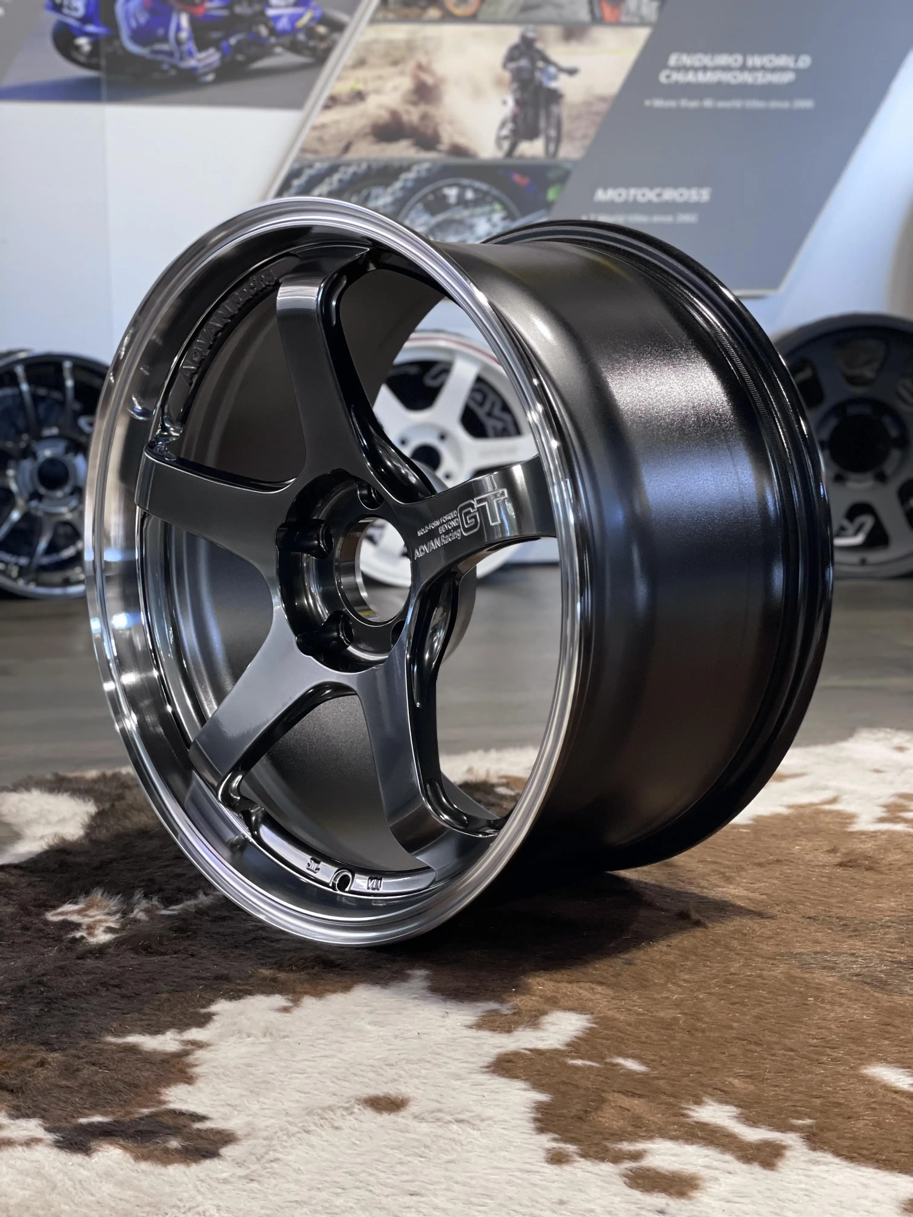 Close up detailing the authentic 3D machined Advan Racing GT Beyond logo lettering on a hyper platinum spoke