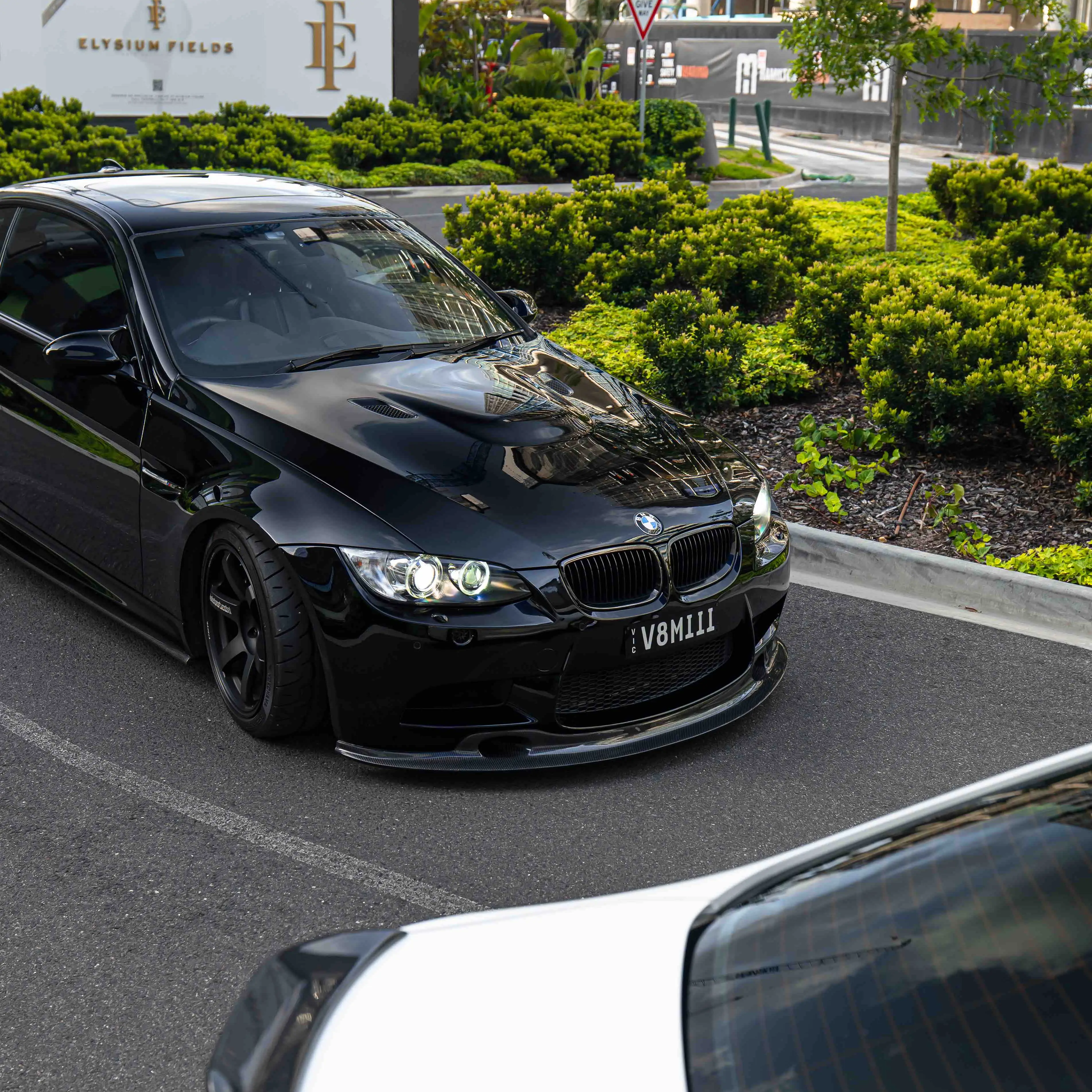 Aggressive three quarter view of black E92 M3 V8 coupe running 18 inch Matte Black TE37 Saga S-Plus fitment
